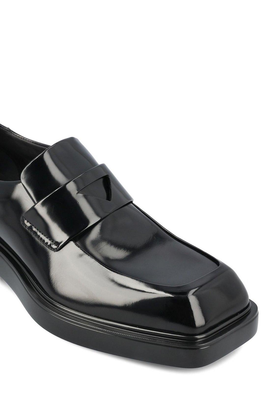 Shop Prada Triangle-patch Slip-on Loafers In Nero