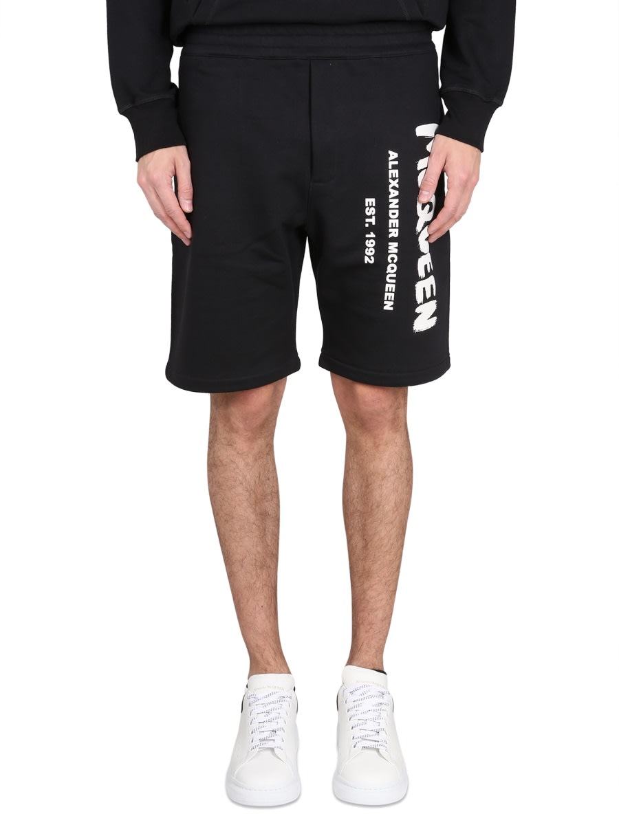 Shop Alexander Mcqueen Bermuda Shorts With Graffiti Logo Print In Black Ivory