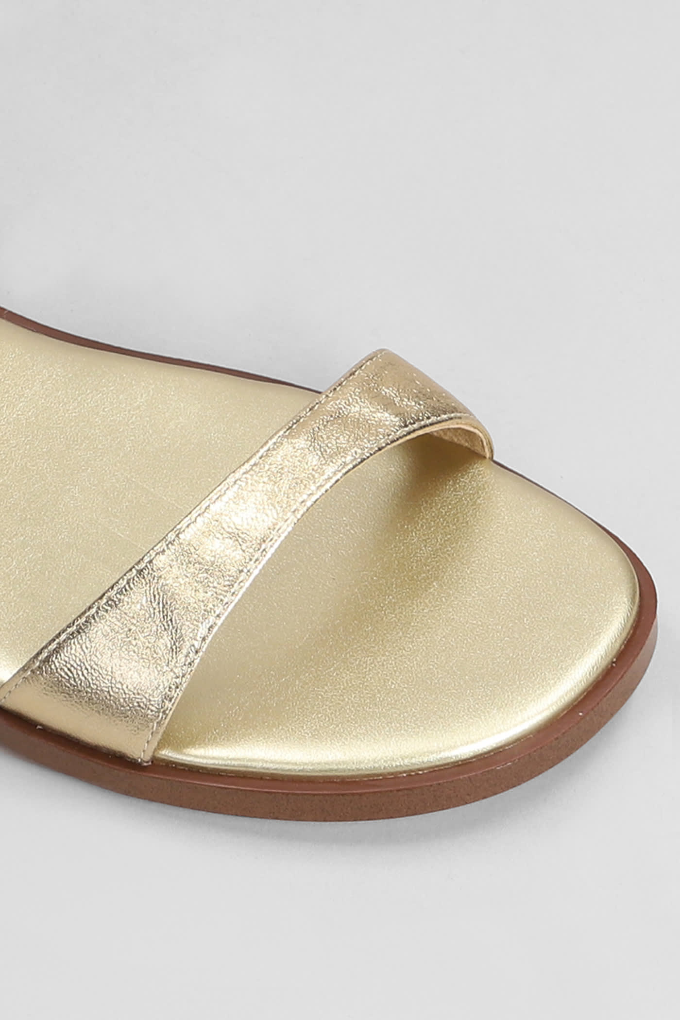Shop Michael Kors Amara Flats In Gold Leather