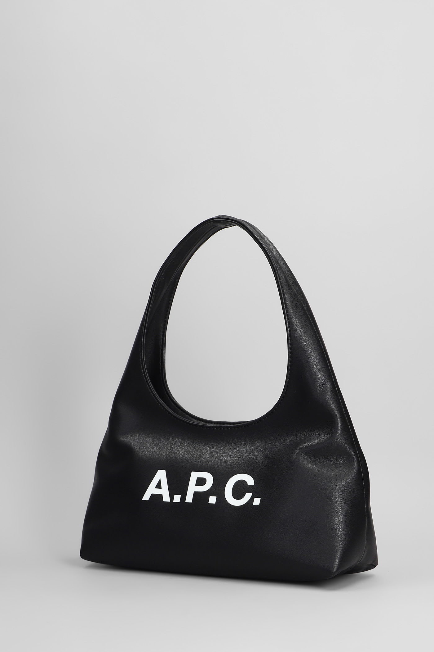 Apc Rounded Silhouette Shoulder Bag With Bold Logo In Black