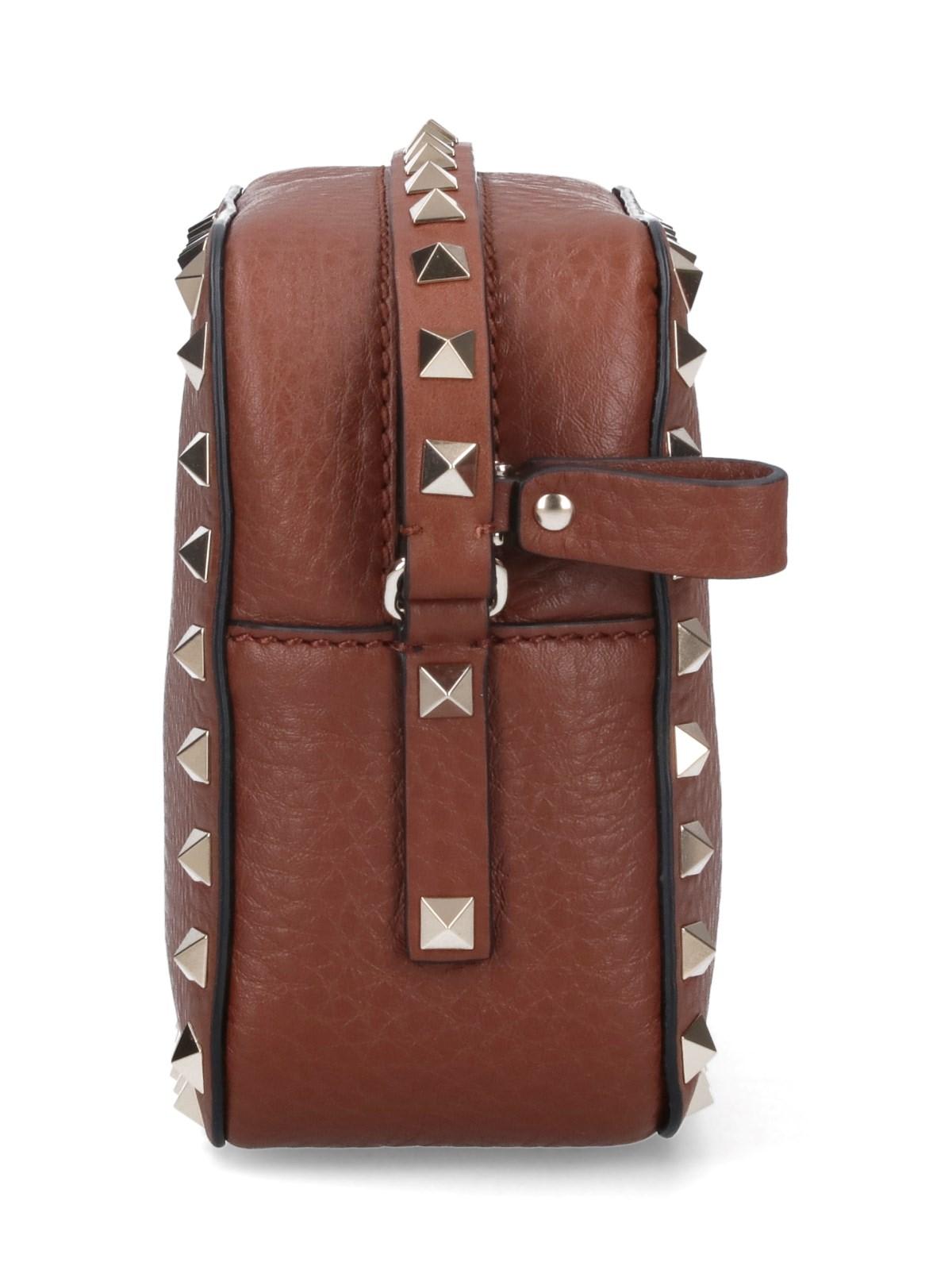 Shop Valentino Rockstud Mini Bag In Brown