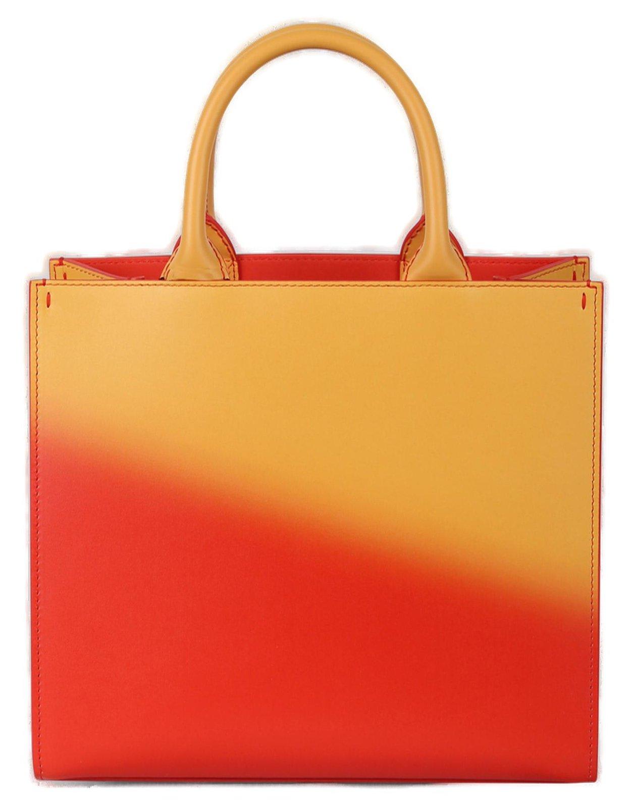 Shop Dolce & Gabbana Dg Logo Embossed Tote Bag In Orange