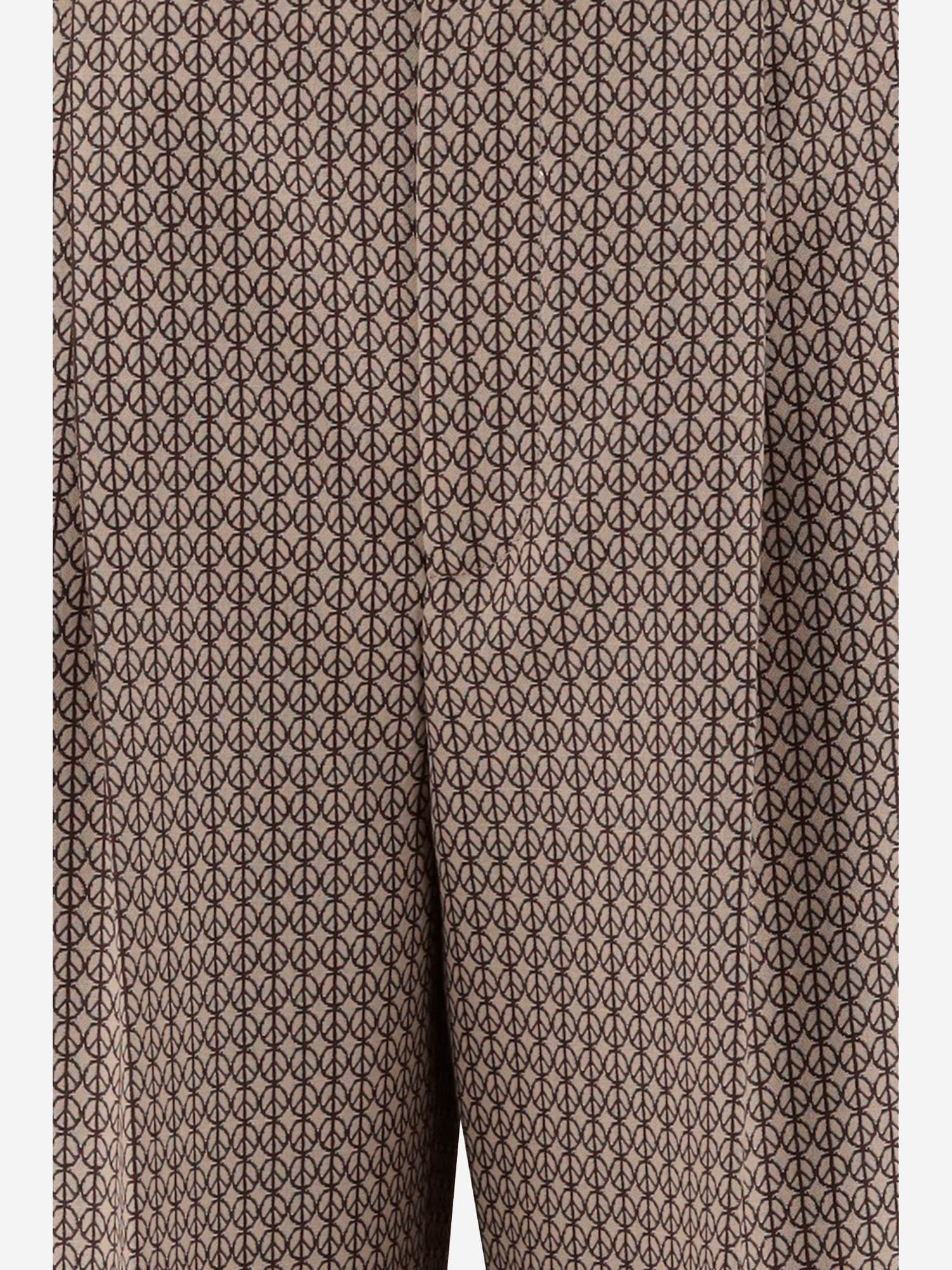 Shop Moschino Wool Pants With Peace Pattern In Beige