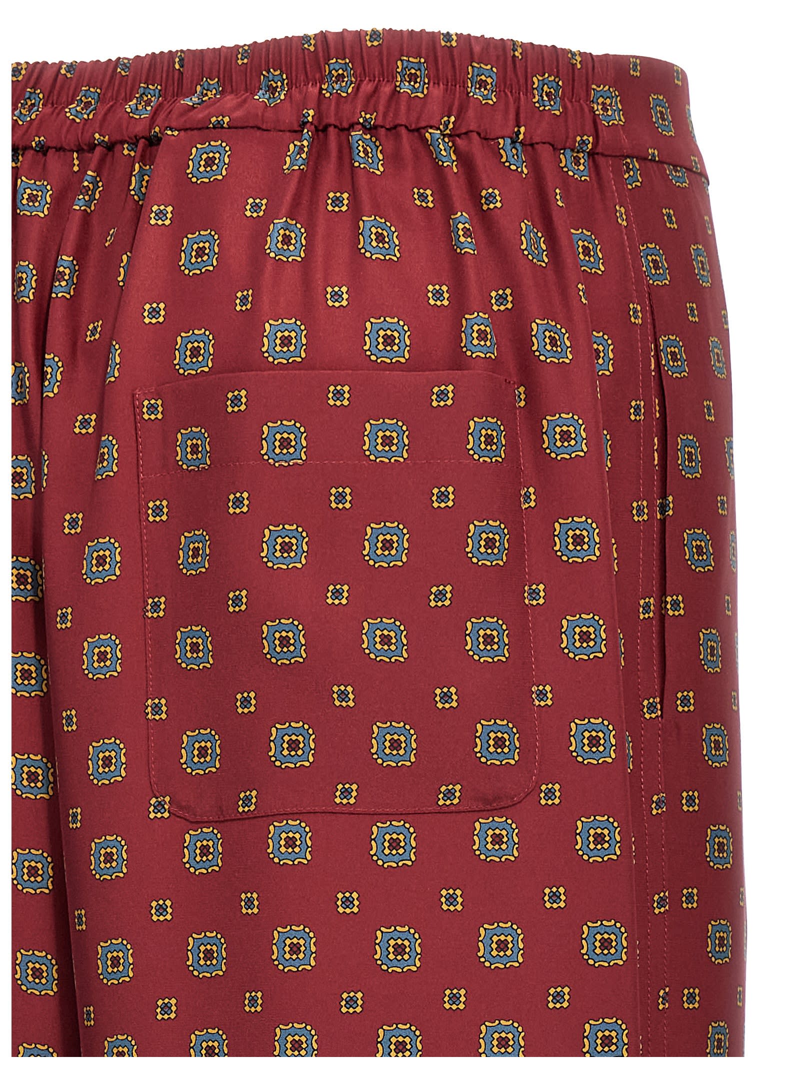 Shop Moschino Patterned Pants In Bordeaux