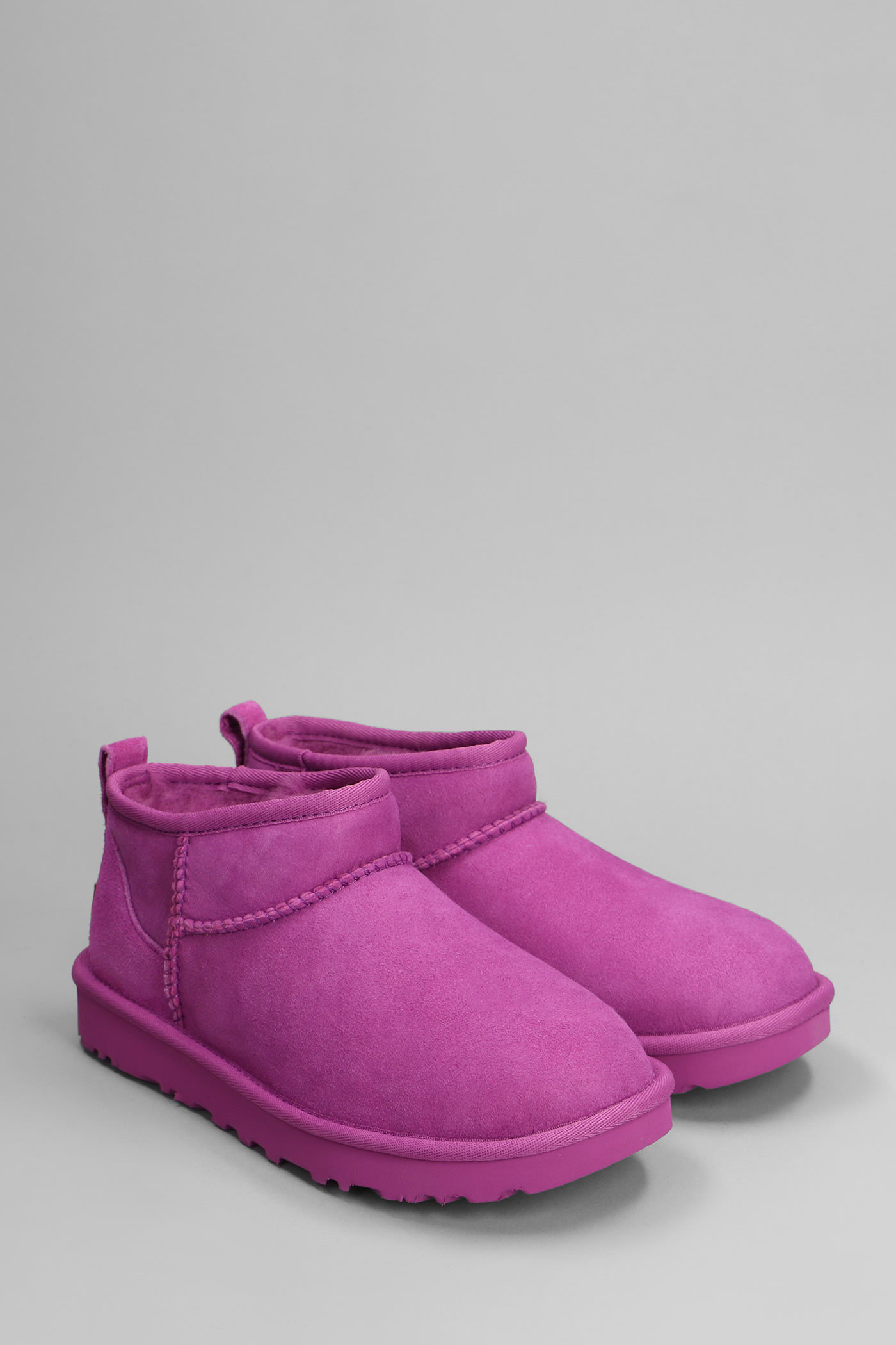 Shop Ugg Classic Ultra Mini Low Heels Ankle Boots In Fuxia Suede