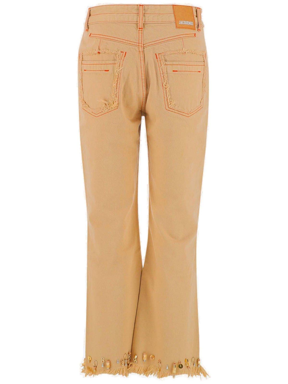Jacquemus Distressed-effect Flared Jeans In Beige