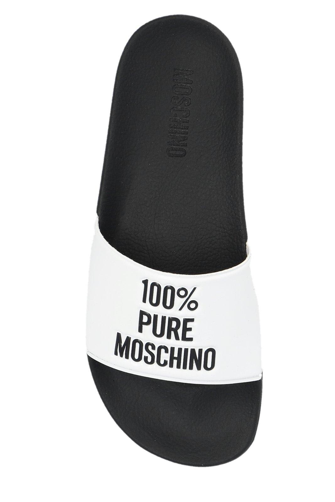 Shop Moschino Logo-embossed Slides In White/black