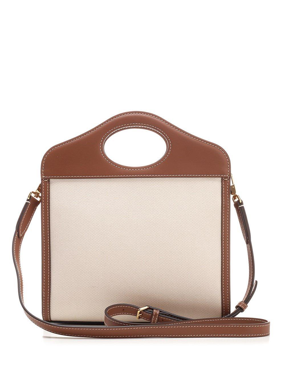 Shop Burberry Pocket Mini Handbag In Natural/malt Brown