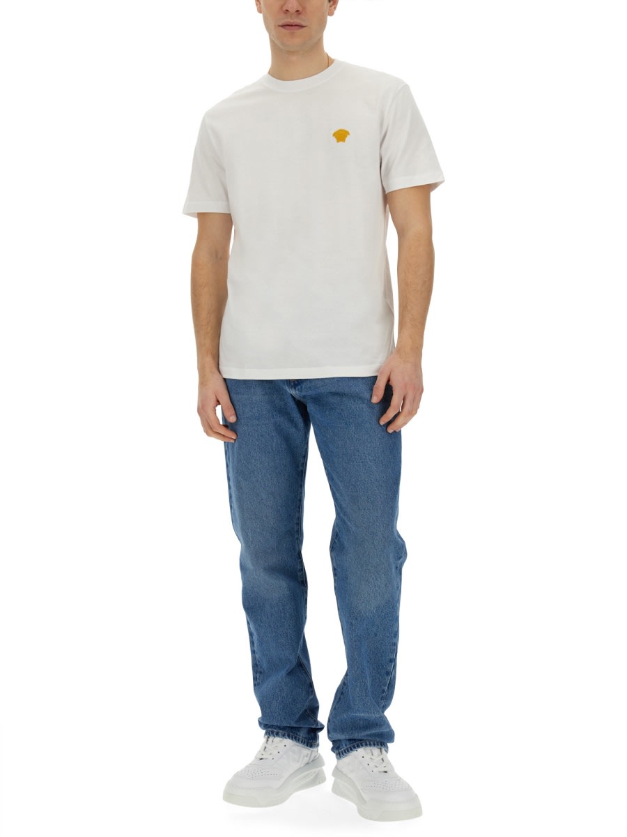 Shop Versace Regular Fit Jeans In Denim