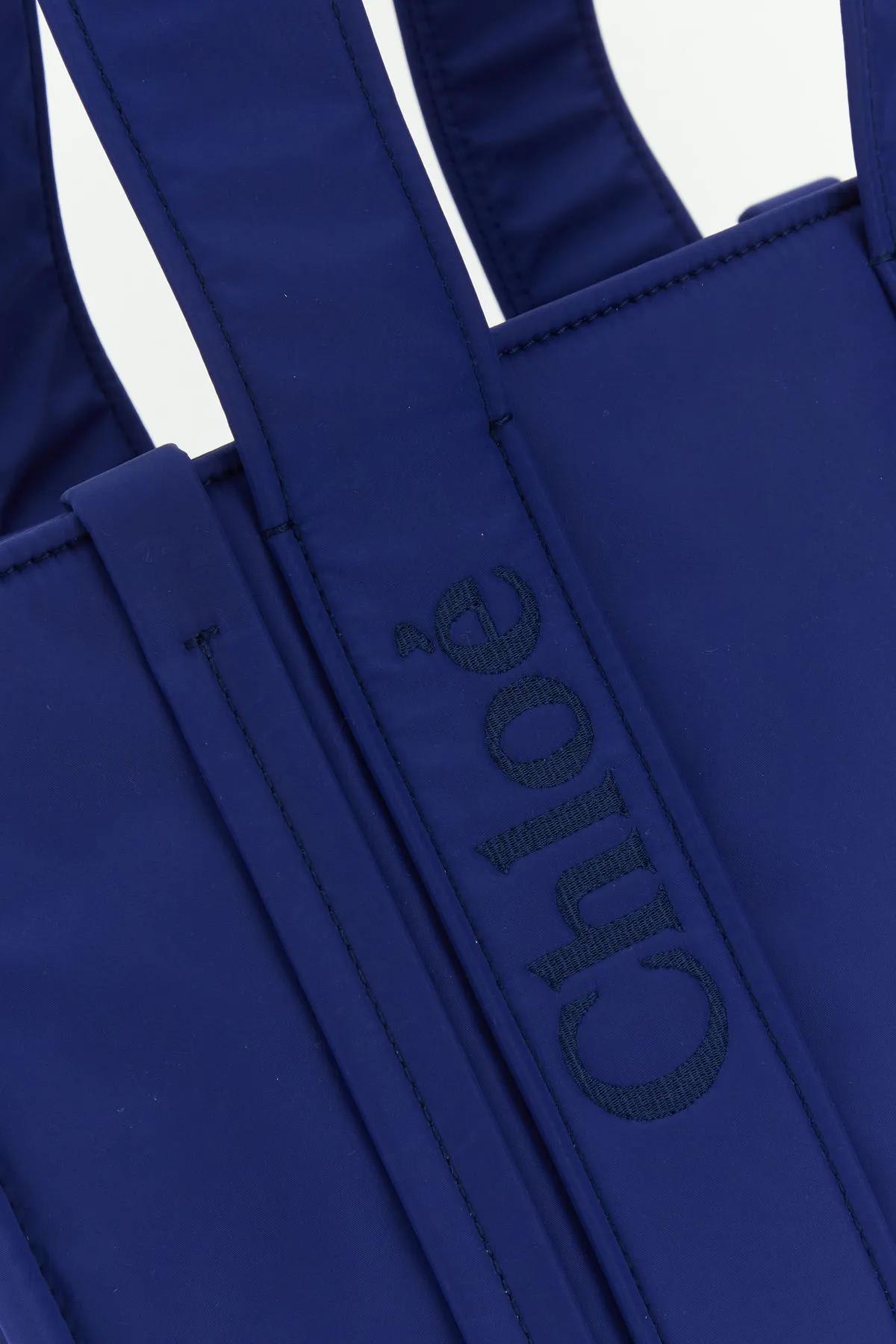 Shop Chloé Electric Blue Nylon Medium Woody Shopping Bag