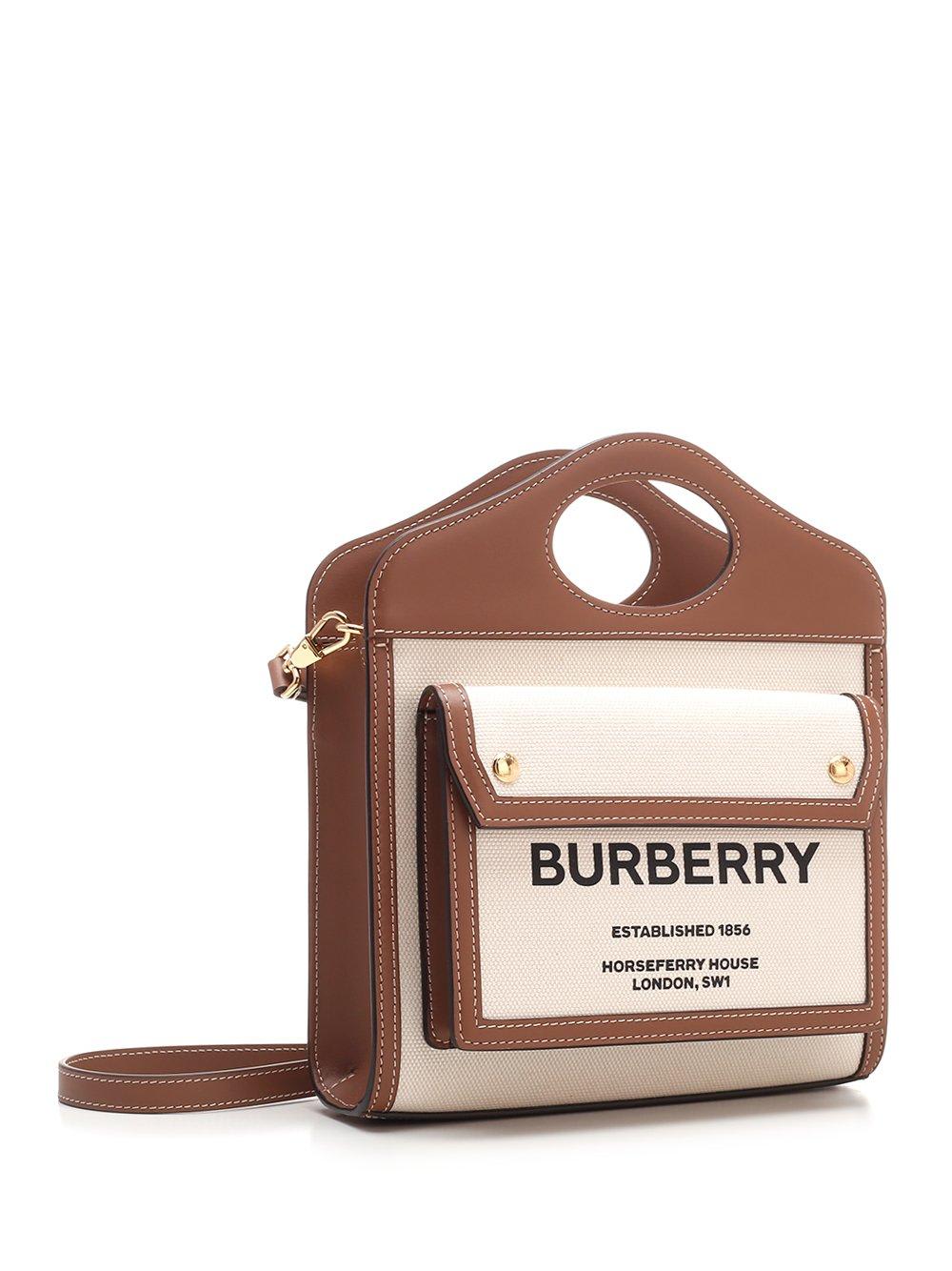 Shop Burberry Pocket Mini Handbag In Natural/malt Brown