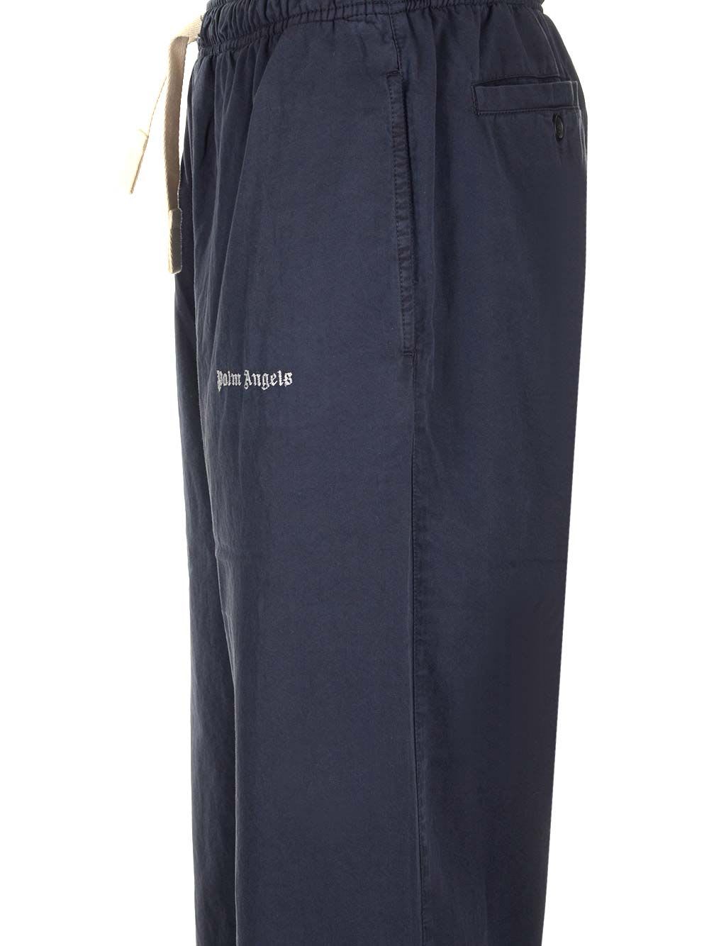 Shop Palm Angels Flared Cotton Trousers In Blue