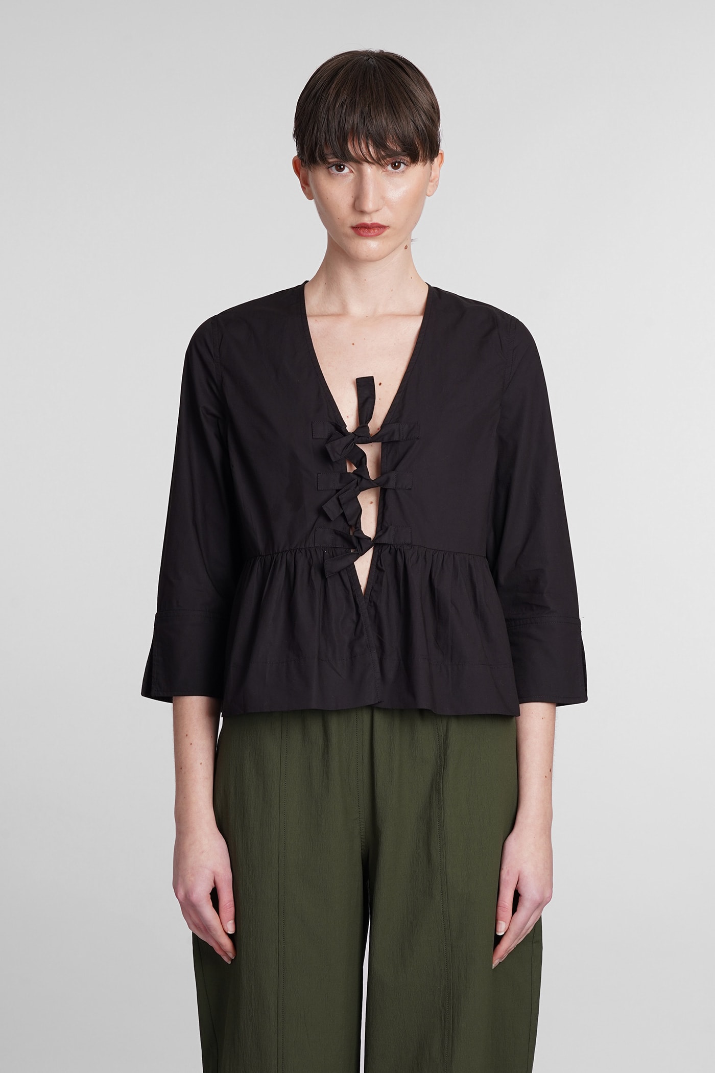 Ganni Puff-sleeved Peplum Blouse In Black