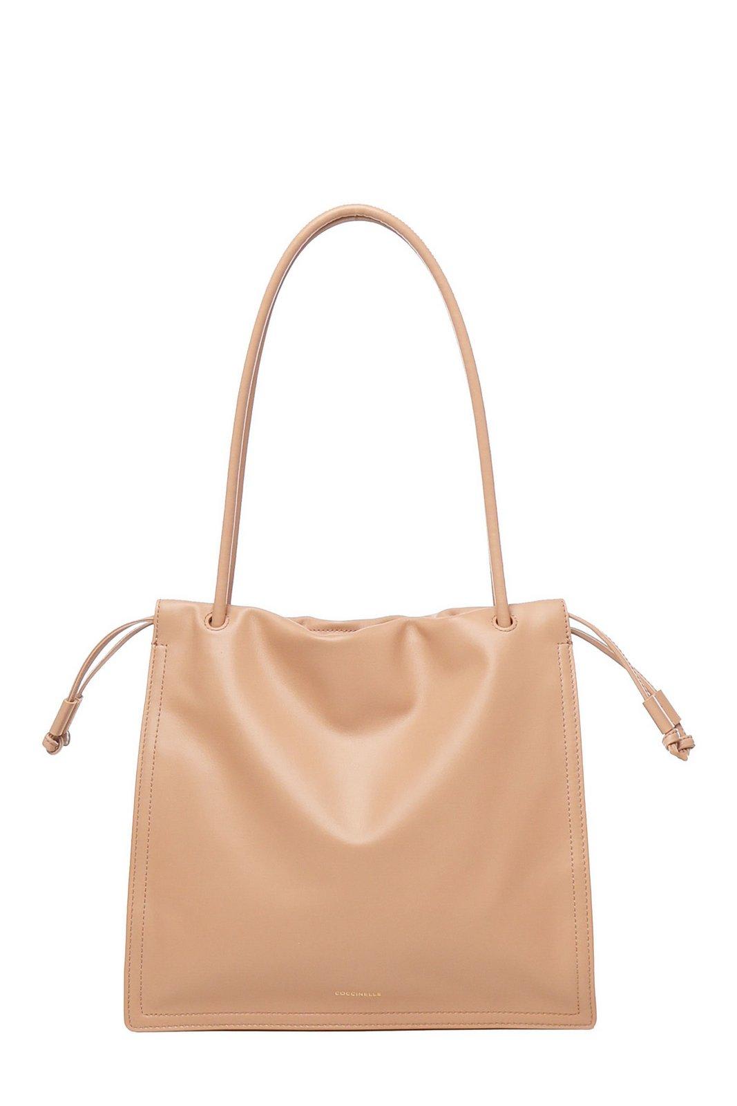 COCCINELLE LOGO EMBOSSED DRAWSTRING TOTE BAG