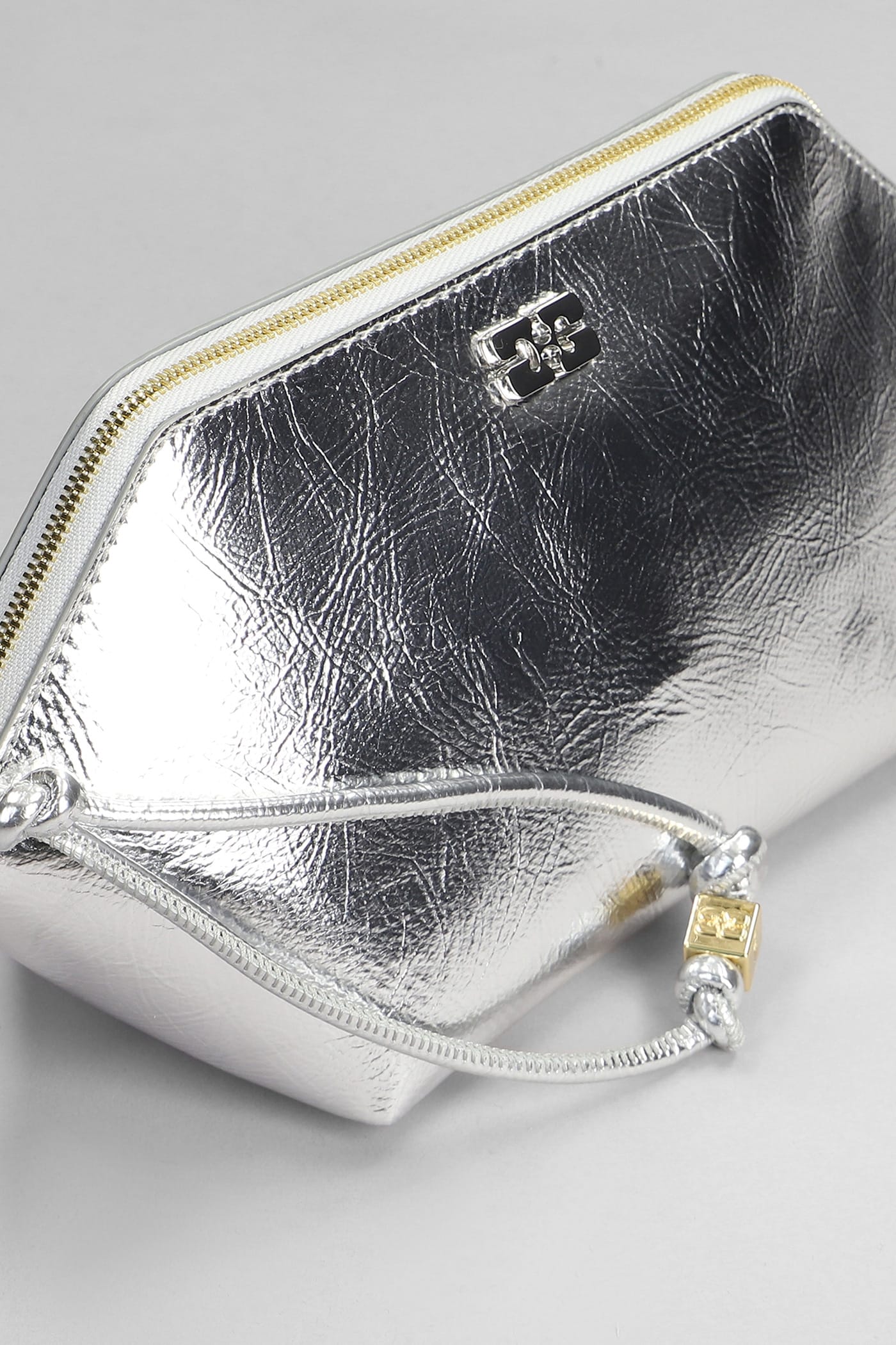 Shop Ganni Bou Zipped Clutch In Silver Leather