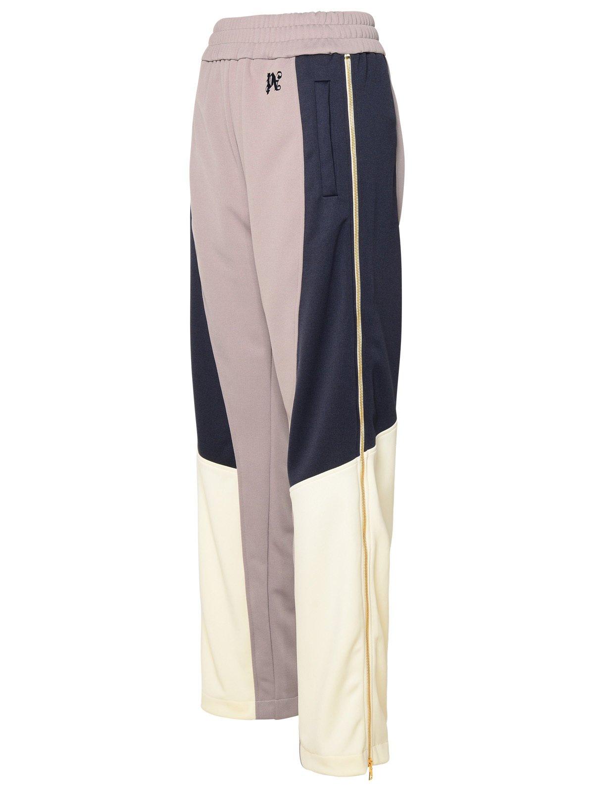 Shop Palm Angels Logo Embroidered Colour-blocked Track Pants In Lilac Mul
