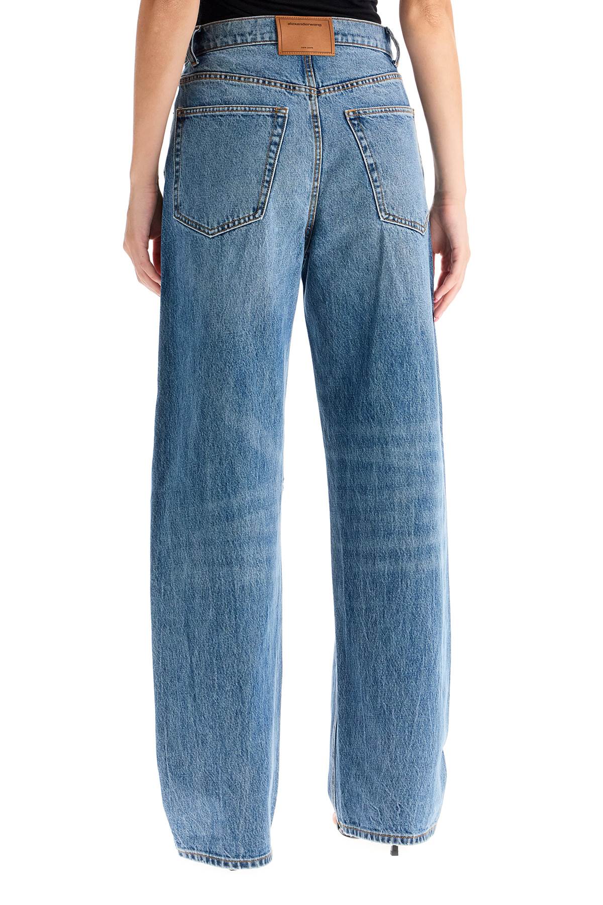 Shop Alexander Wang Distressed Jeans With Lettering Logo In Vintage Medium Indigo (light Blue)