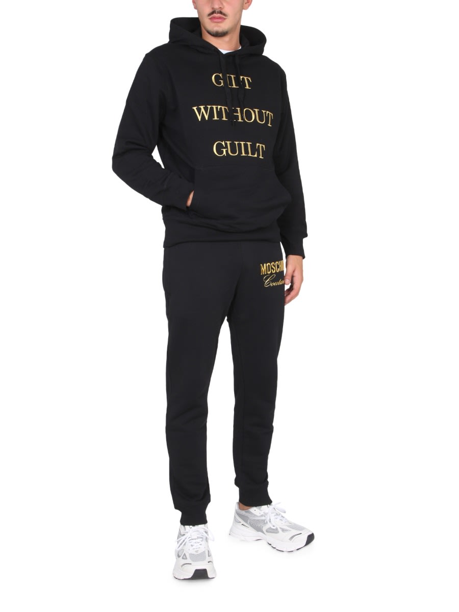 Shop Moschino Guilt Without Guilt Sweatshirt In Black