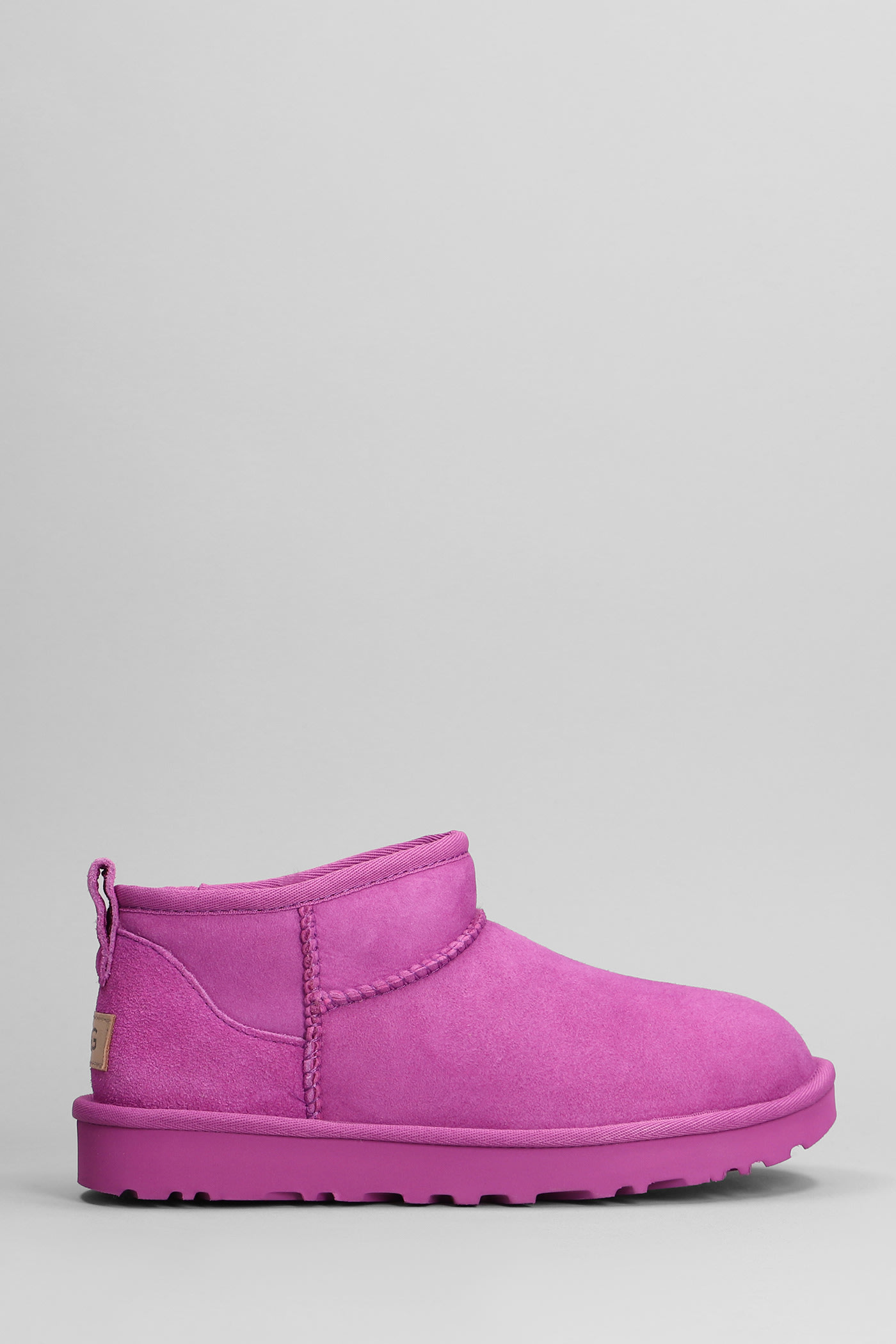 Shop Ugg Classic Ultra Mini Low Heels Ankle Boots In Fuxia Suede