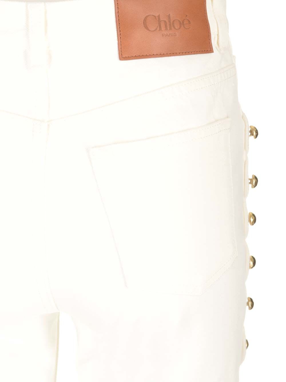 Shop Chloé Cropped Jeans With Embellished Profile In White