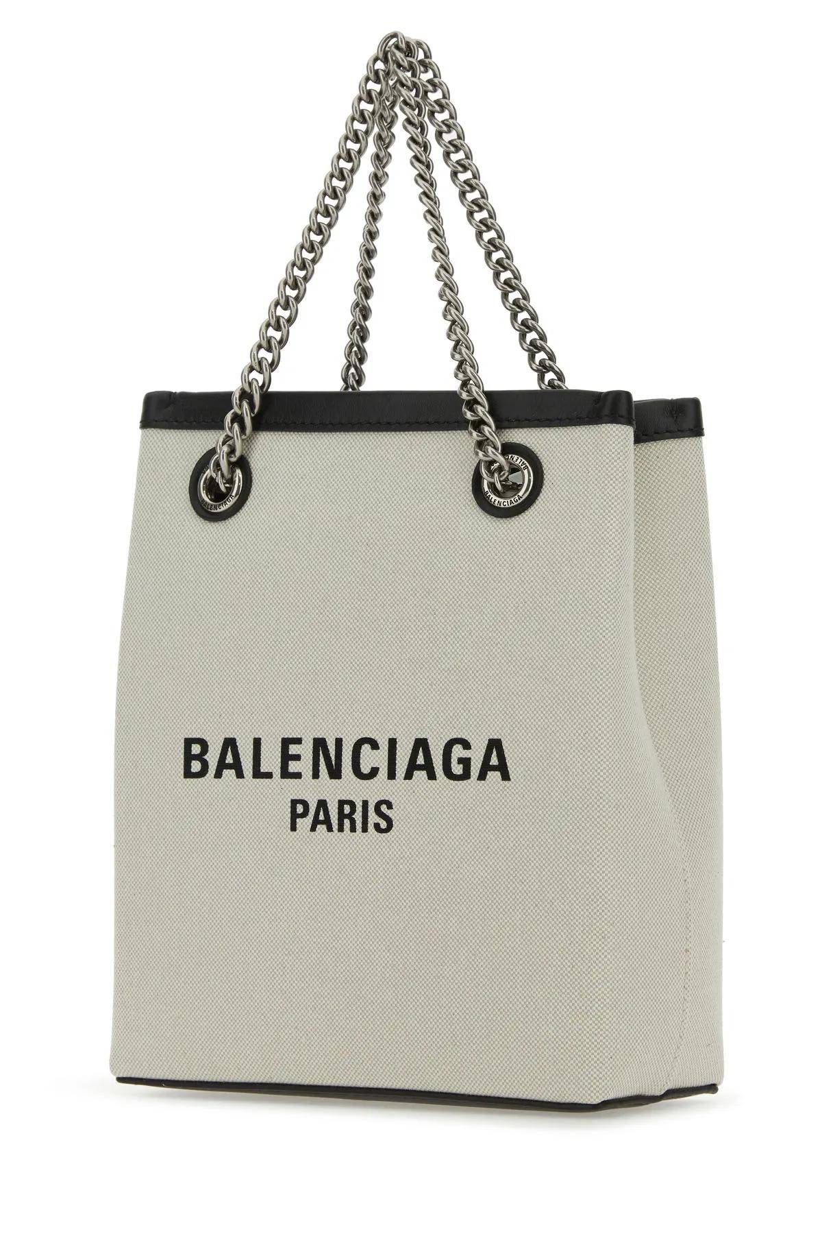 Shop Balenciaga Sand Canvas Duty Free Handbag In Beige