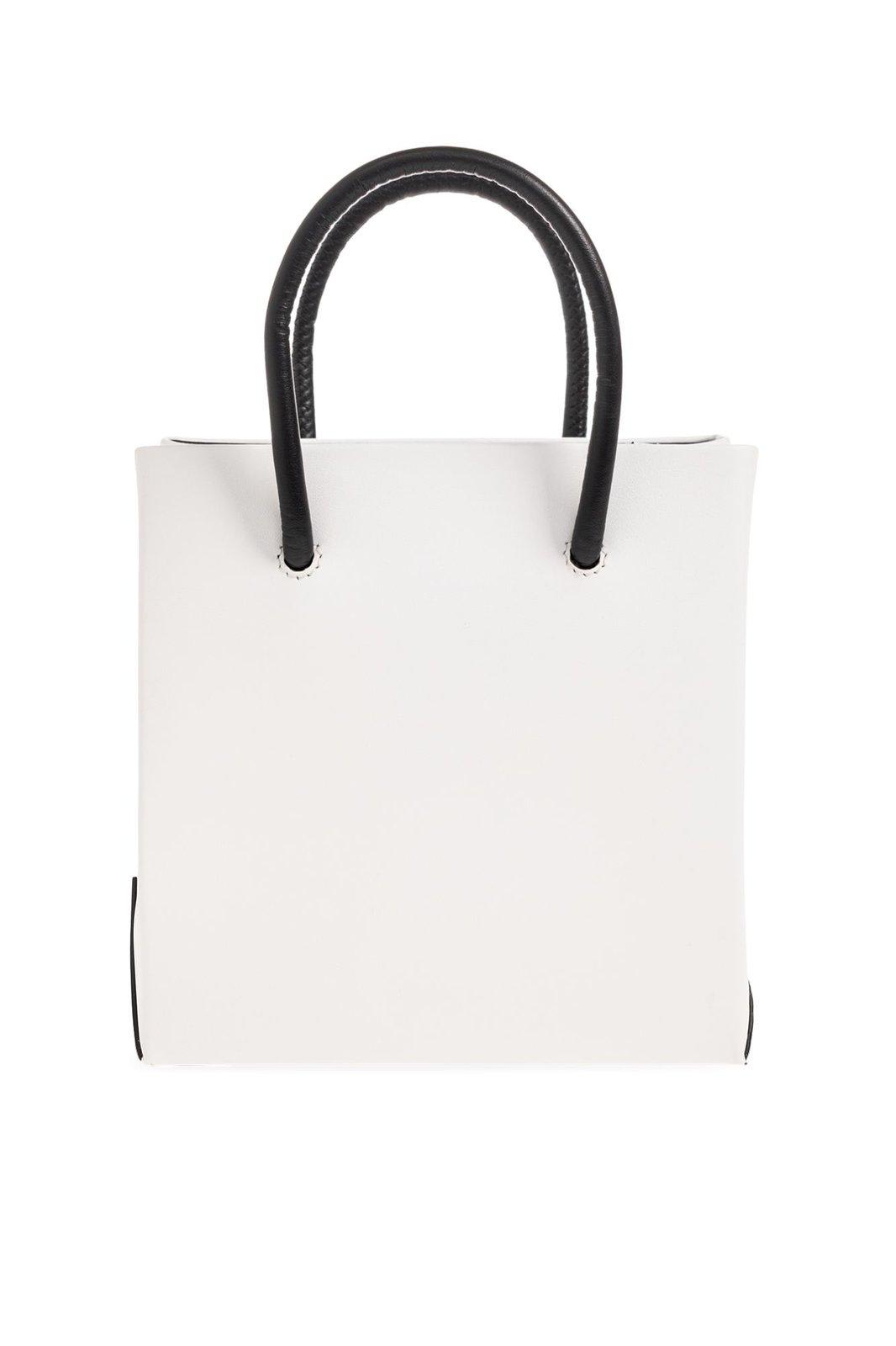 Shop Moschino Slogan-printed Top Handle Bag In White