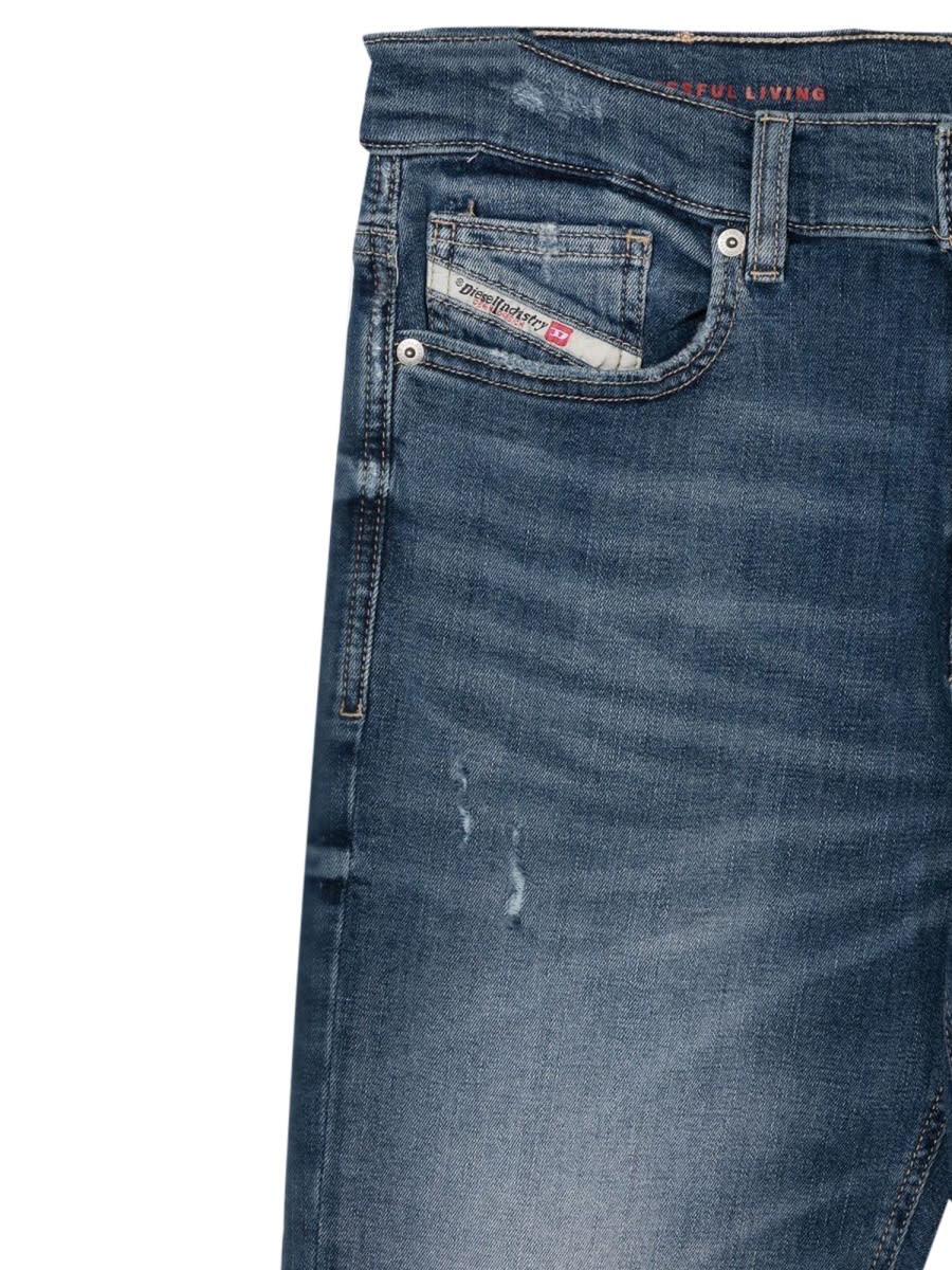 Shop Diesel Lucas Jeans With Patch Breaks In Blue