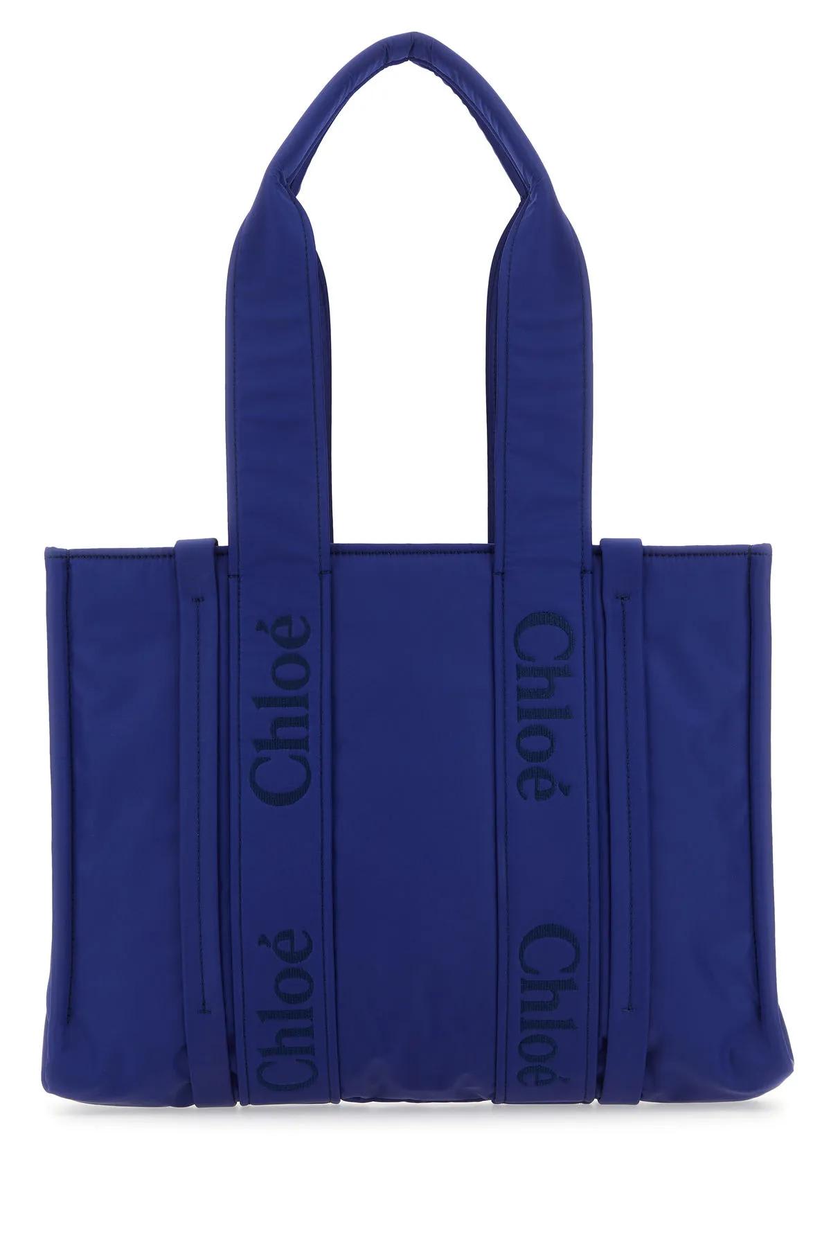 Shop Chloé Electric Blue Nylon Medium Woody Shopping Bag