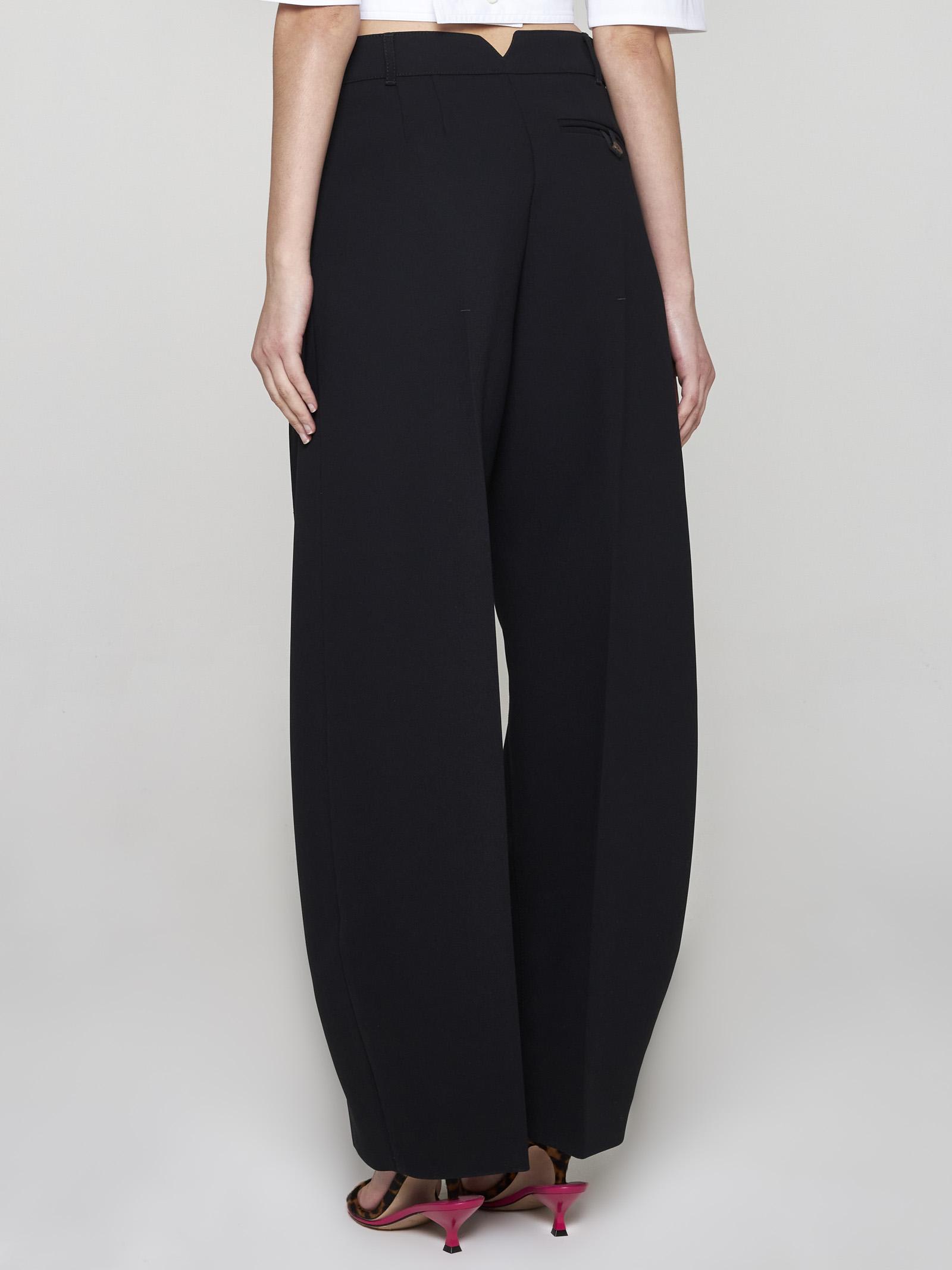 Shop Jacquemus Ovalo Trousers In Black