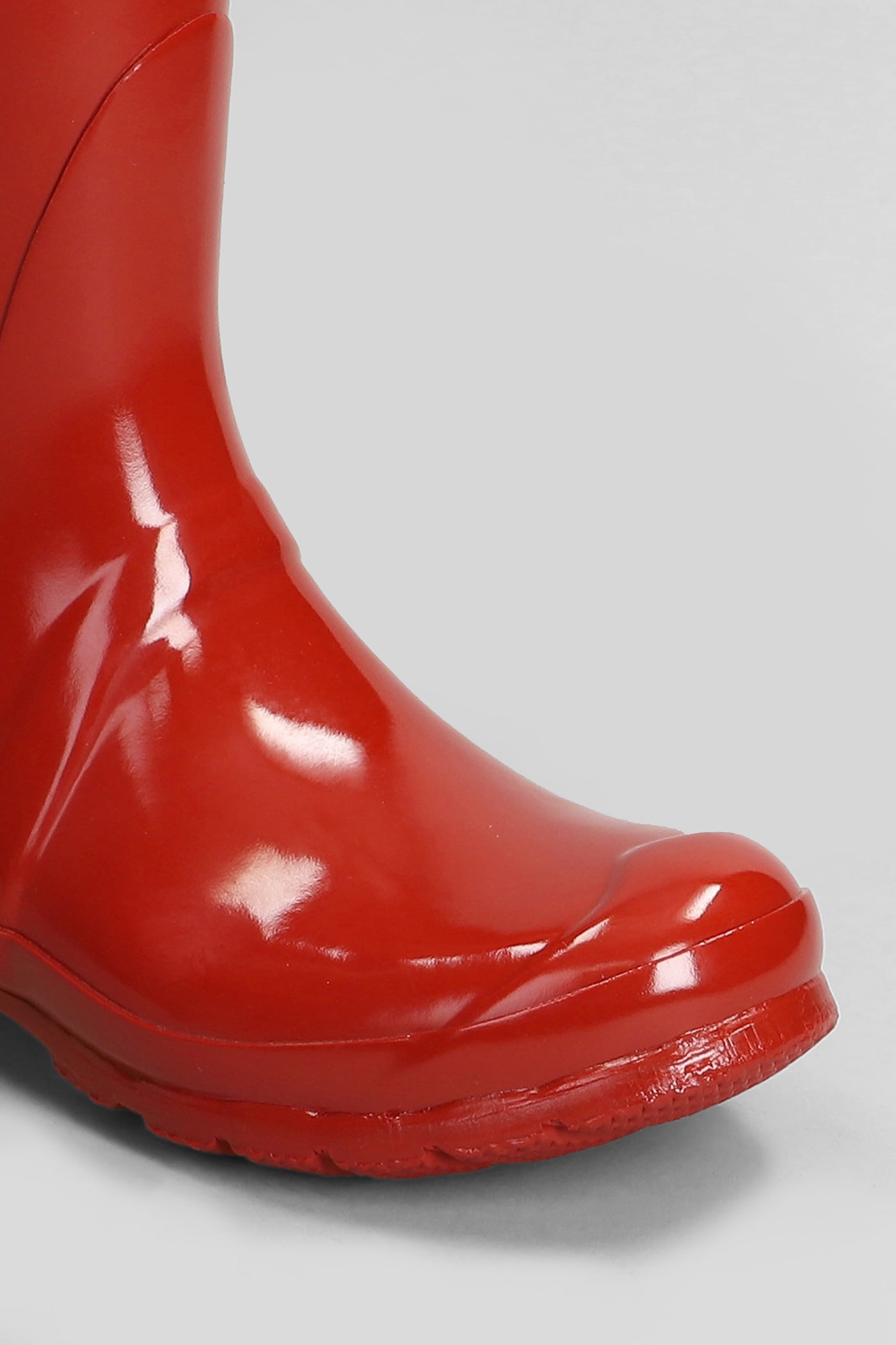 Shop Hunter Original Short Gloss Low Heels Boots In Red Rubber/plasic