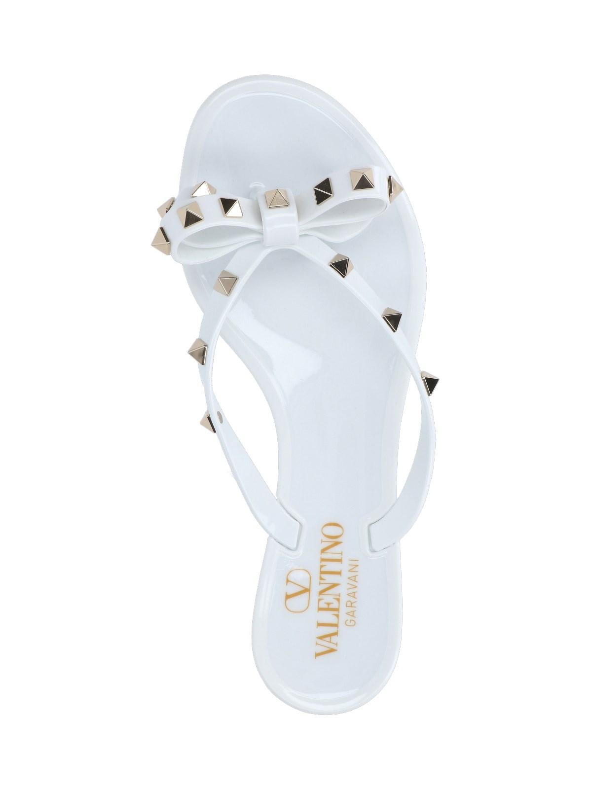 Shop Valentino Thong Sandals Rockstud In White