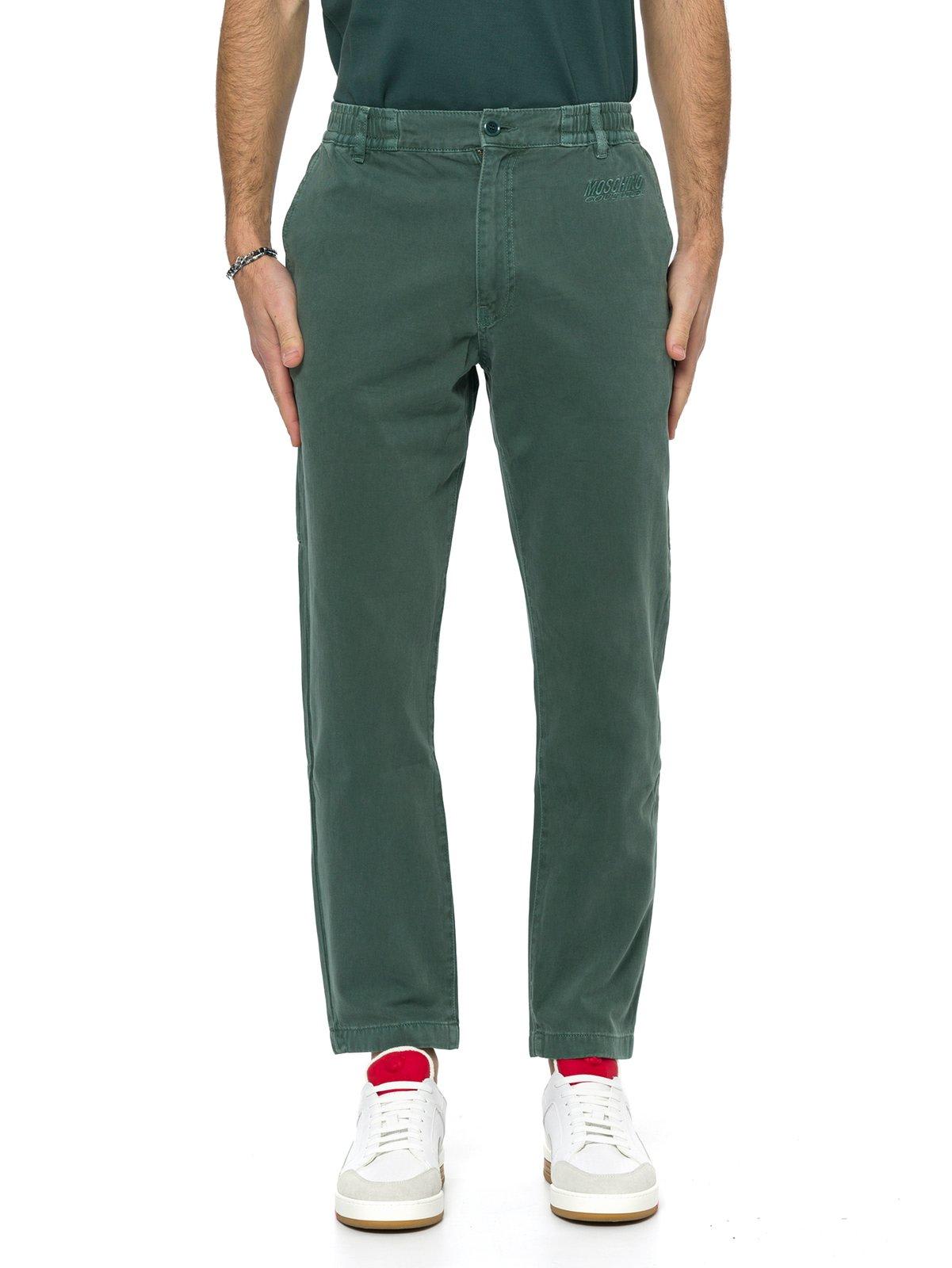 Shop Moschino Log Embroidered Tapered Slim-fit Jeans In Verde