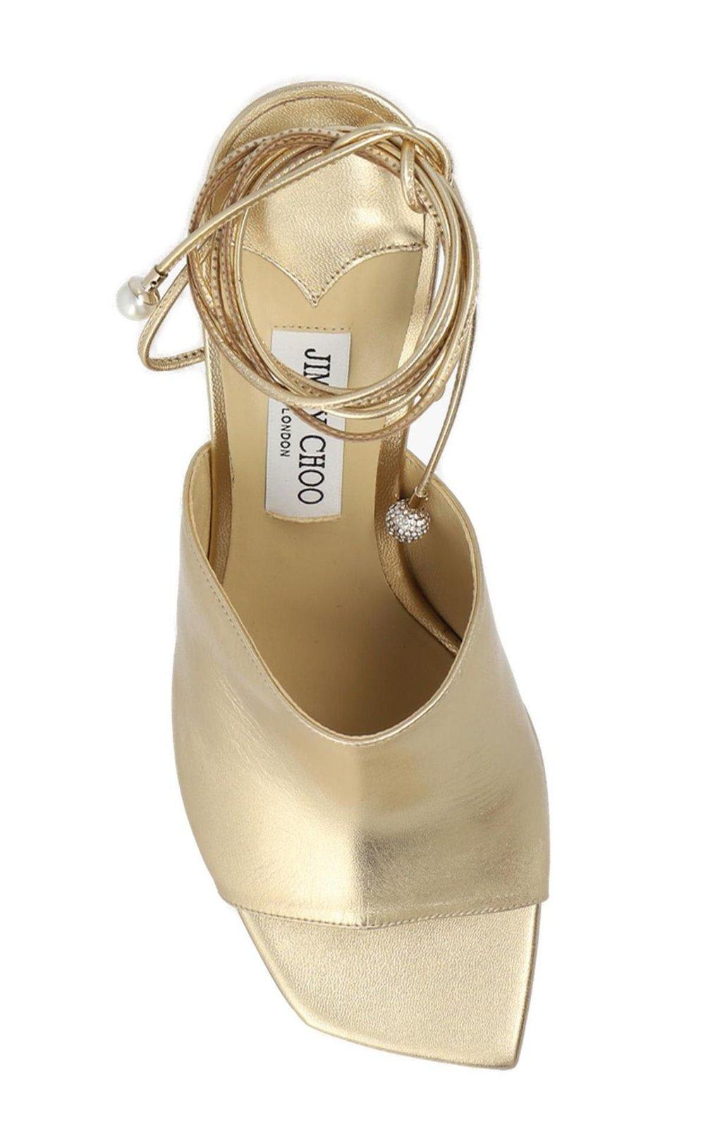 Shop Jimmy Choo Elyna Wedge Sandals In Gold