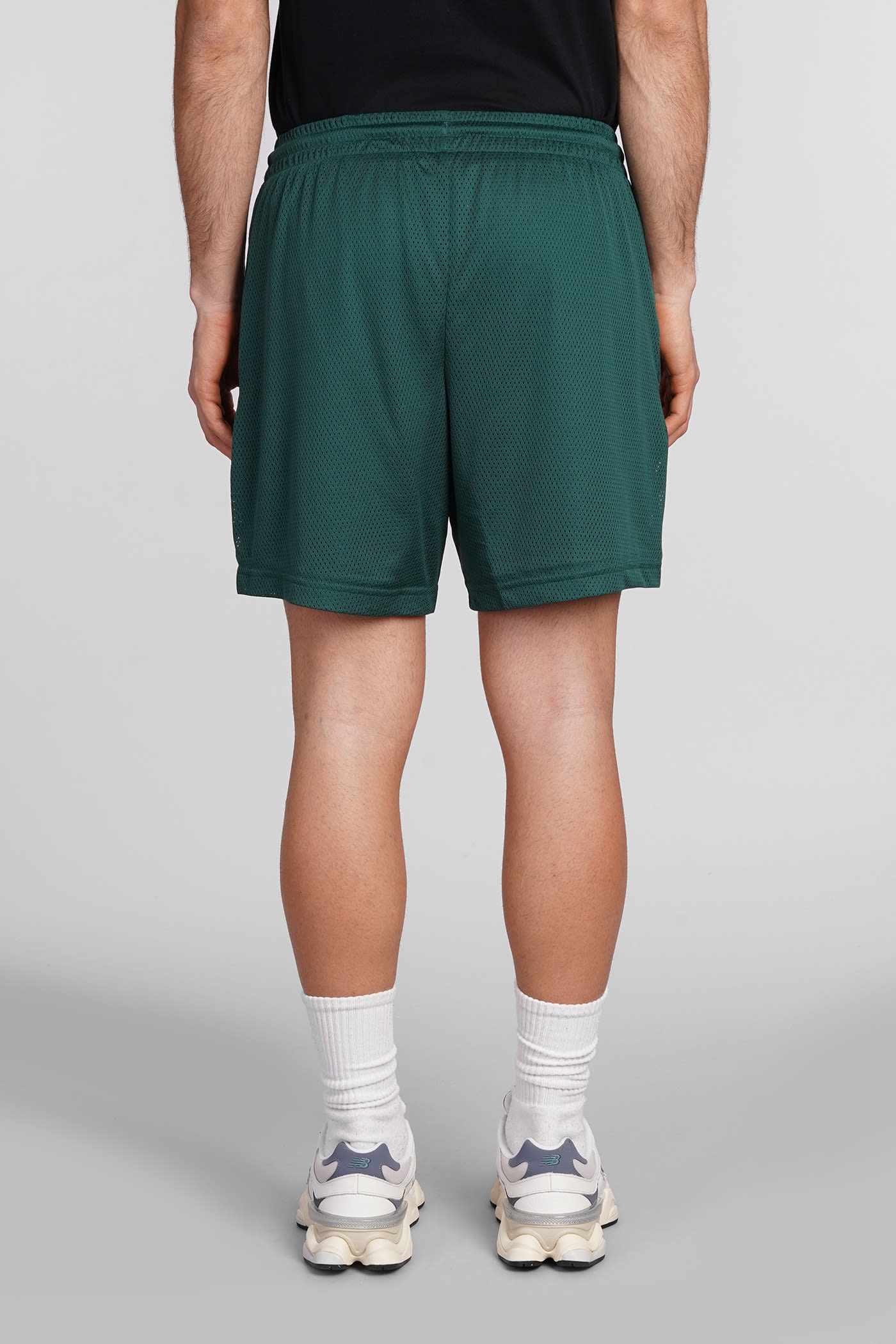 NEW BALANCE SHORTS IN GREEN POLYESTER