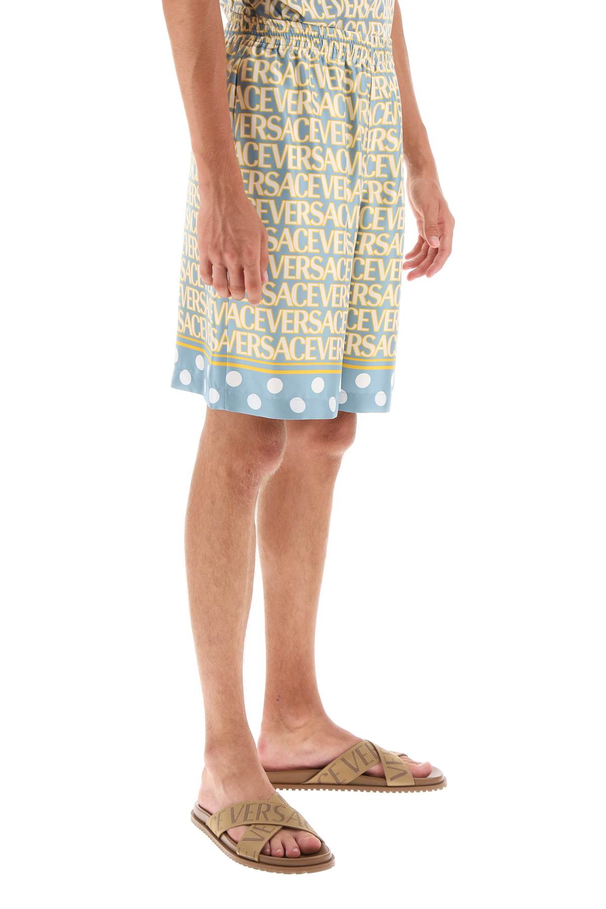 Versace Silk Bermuda Shorts With All-over Logo In Light Blue Ivory (light Blue)