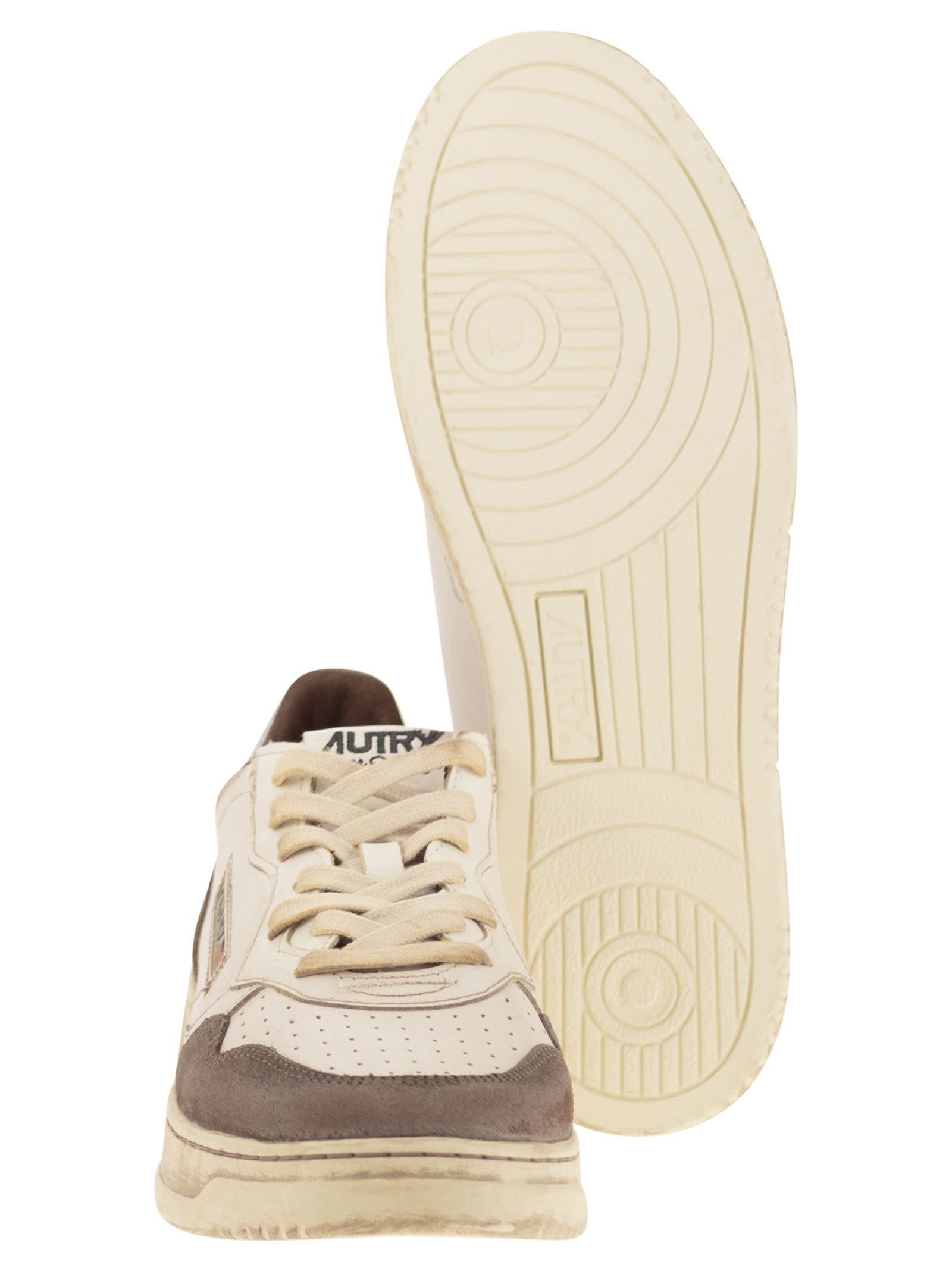 Autry Low Top Sneakers With Contrasting Leather Inserts In White