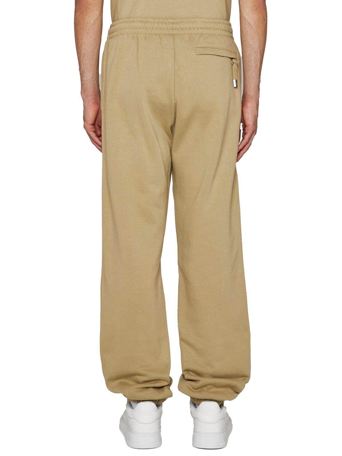 Shop Jacquemus Logo Printed Elasticated Waistband Track Pants In Brown