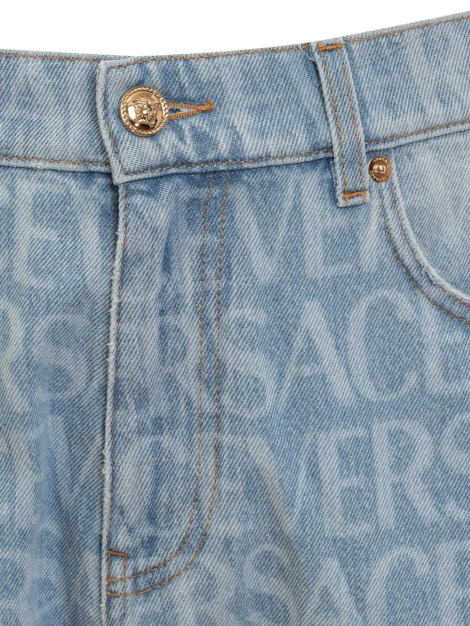Shop Versace Allover Jeans In Azzurro