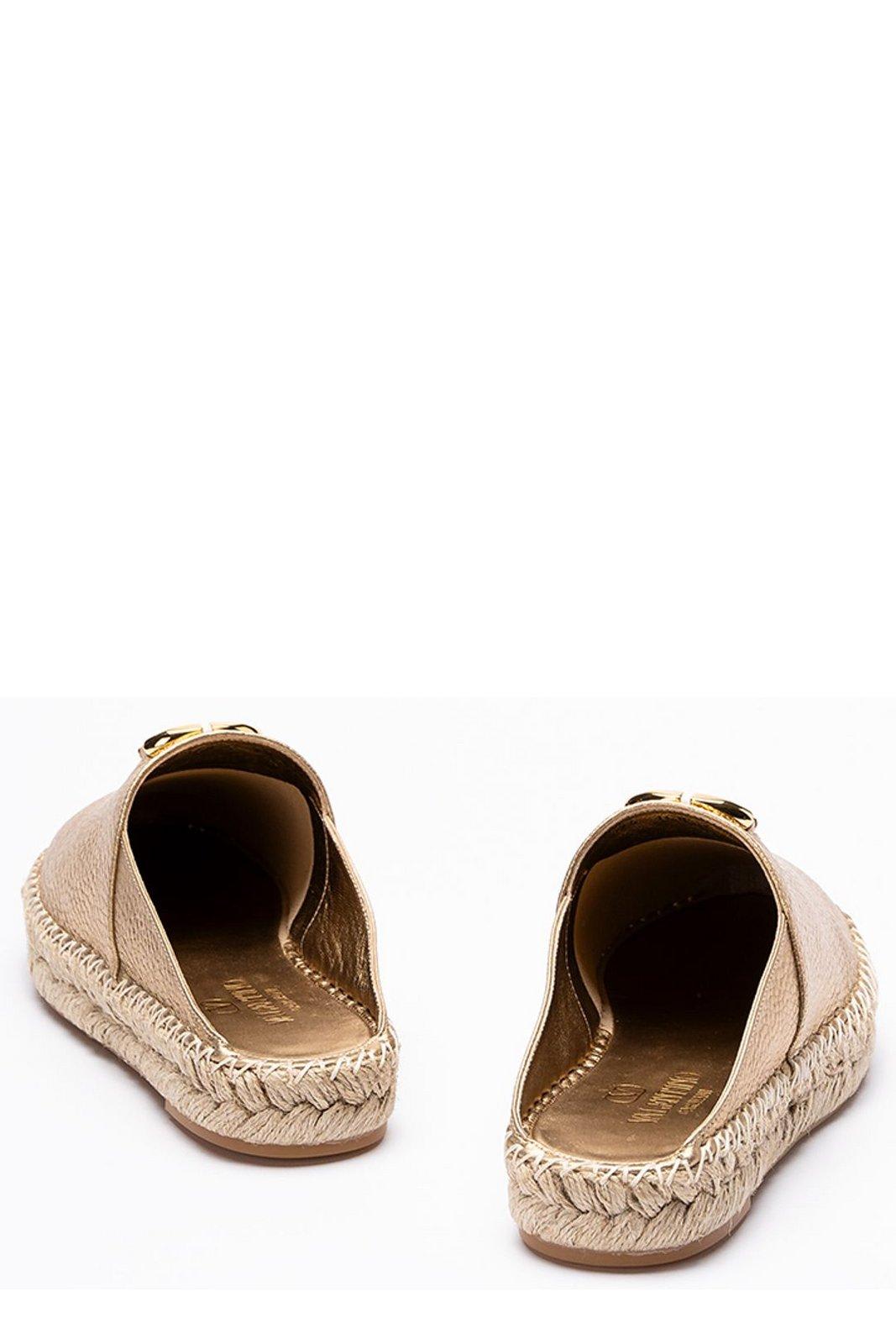 Shop Valentino Garavani Vlogo Plaque Round-toe Mules In Golden