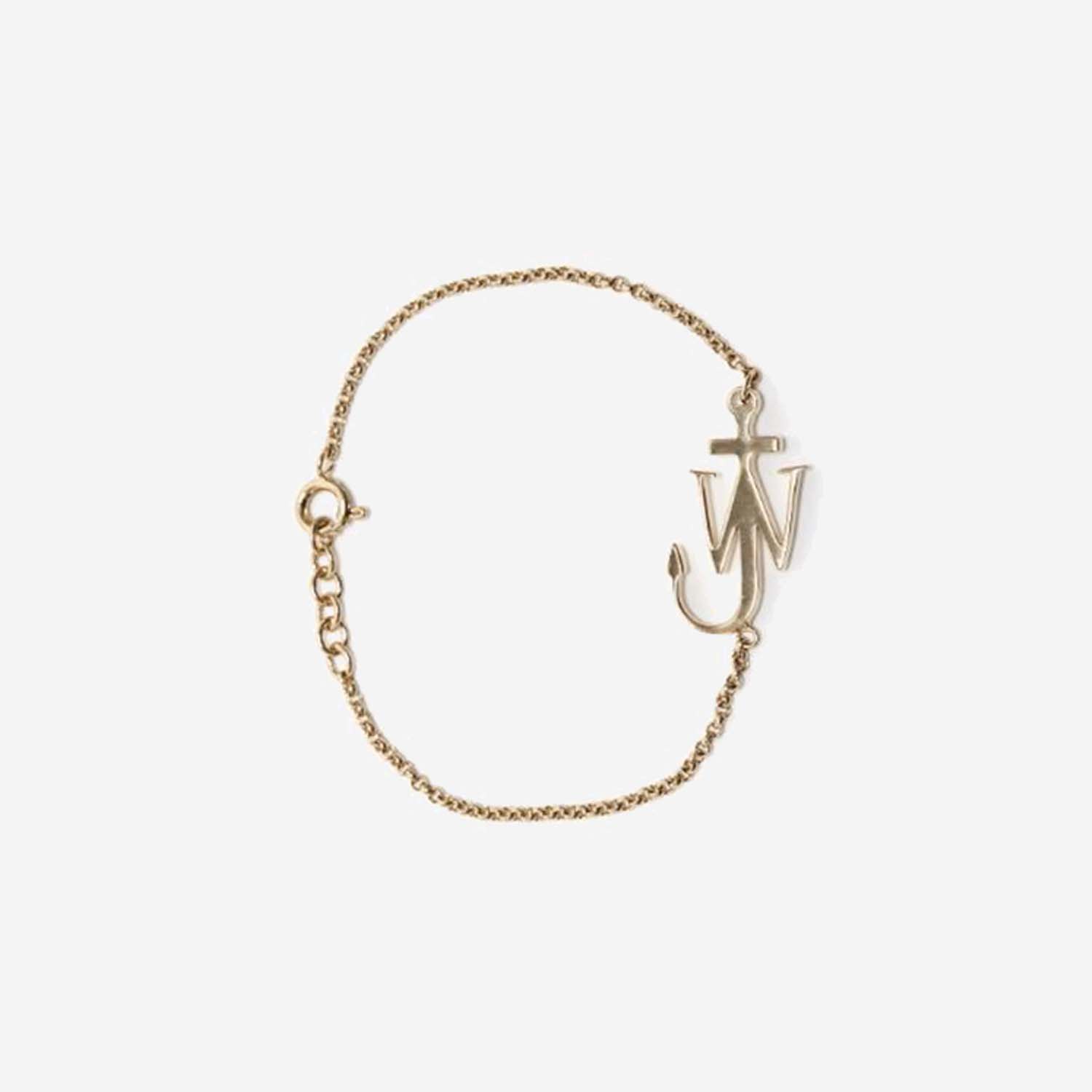 Jw Anderson Brass Logo Bracelet In Golden