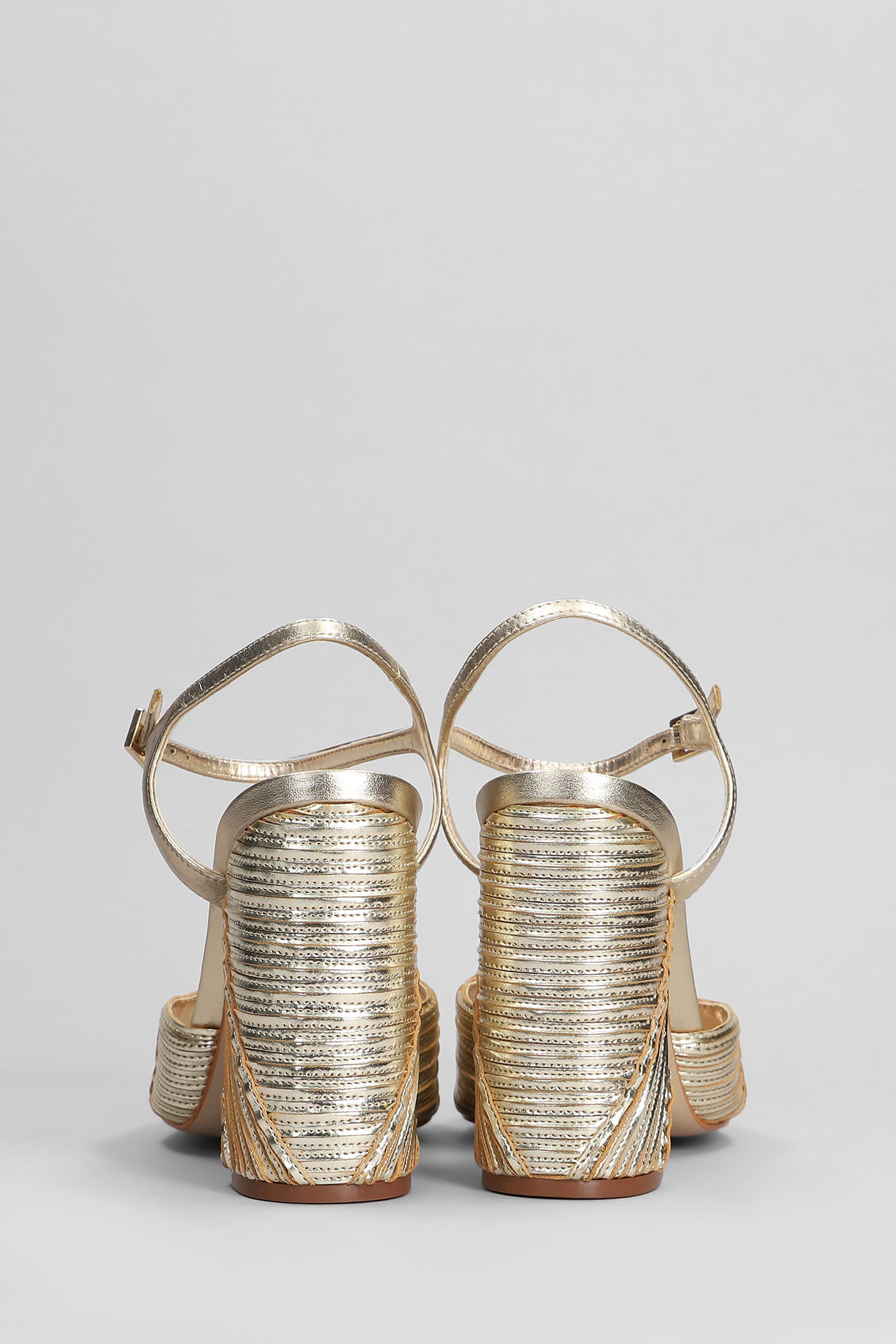 Shop Schutz Lupita Sandals In Gold Leather