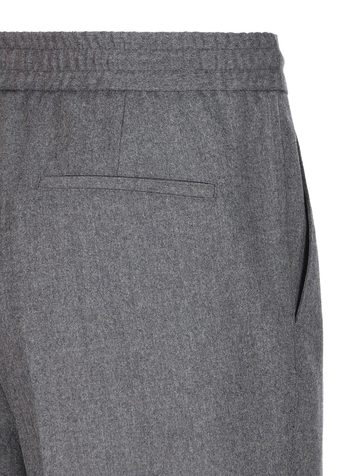 Shop Brunello Cucinelli Pleated Tapered Leg Trousers In Grigio Medio