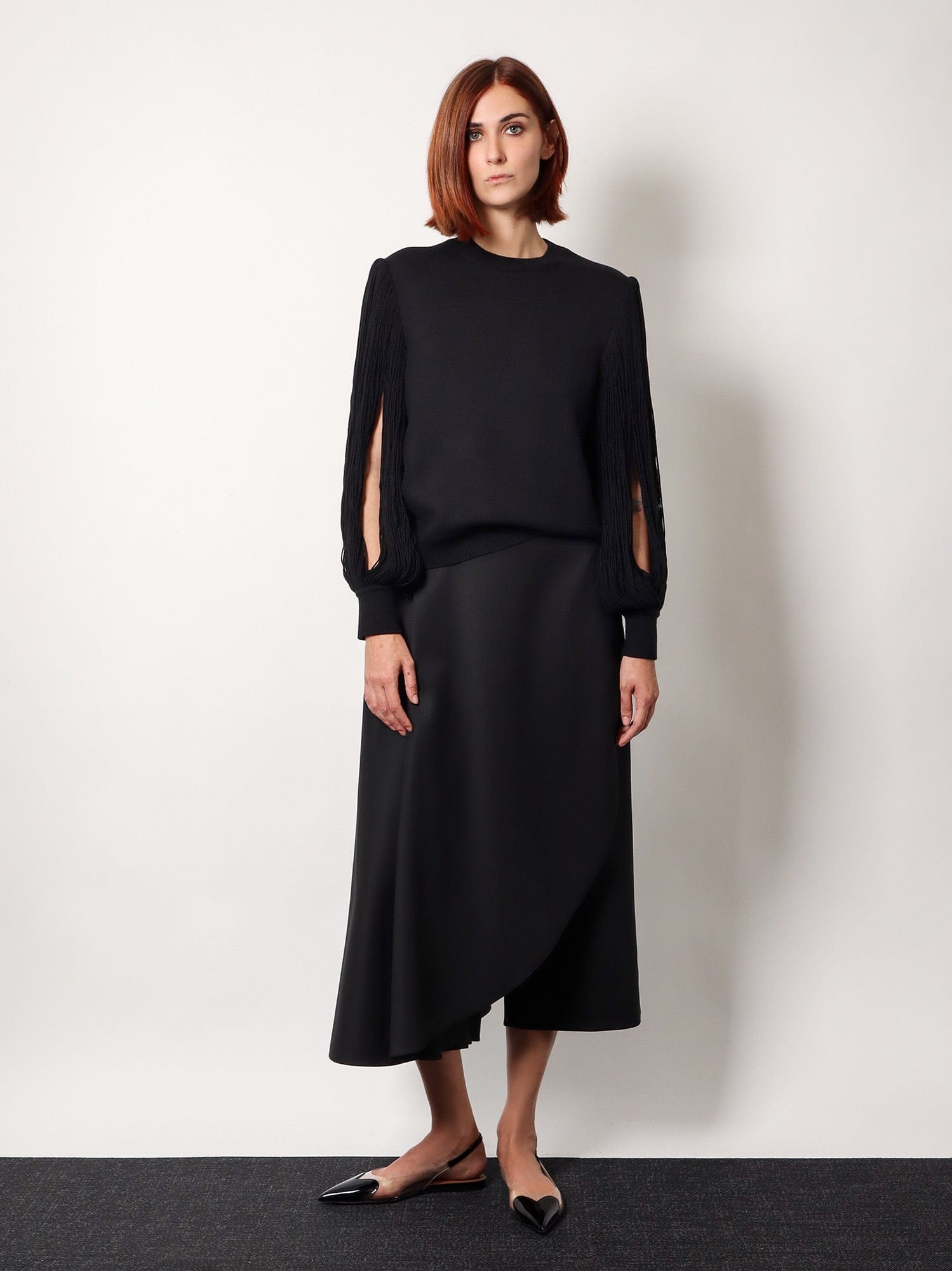 Alaïa Slit Fringe Sleeve Wool Crewneck Sweater In Black