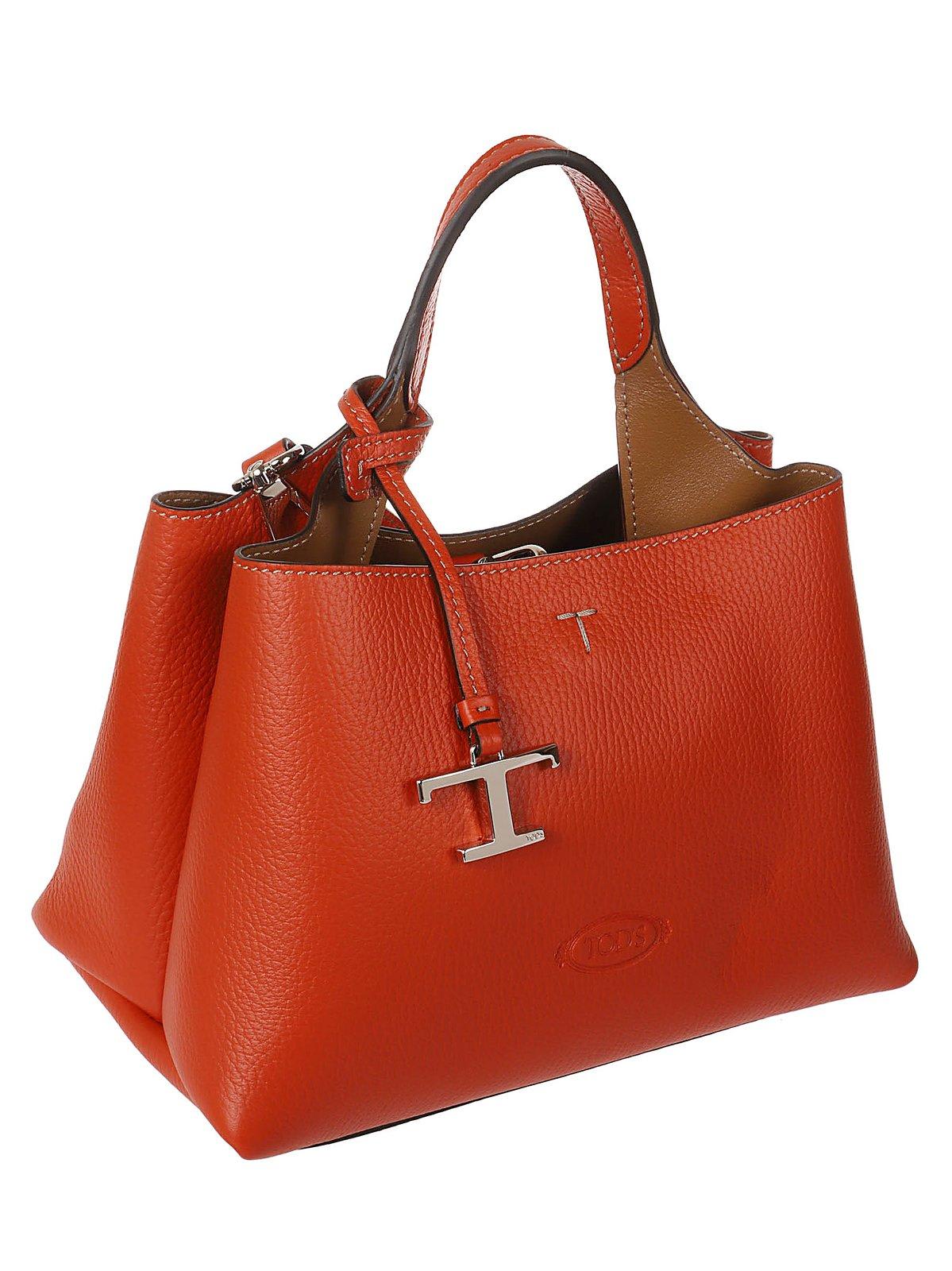 Shop Tod's Logo Embossed Mini Crossbody Bag In Arancio