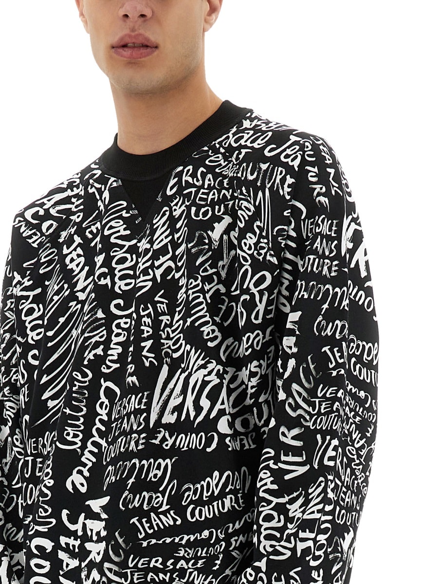 Shop Versace Jeans Couture Sweatshirt With Logomania Print In Black