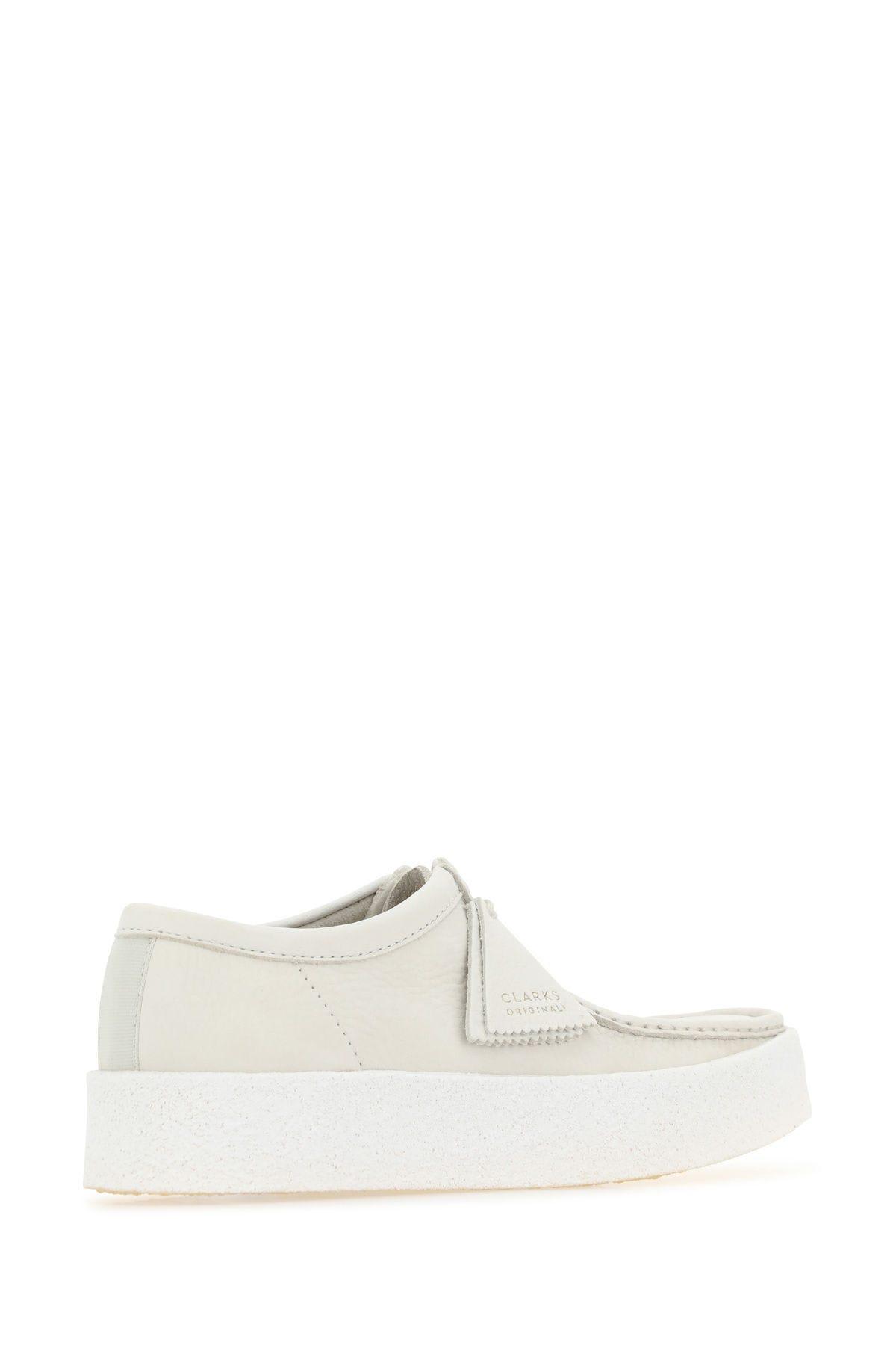 Shop Clarks Sand Nubuck Wallabee Ankle Boots In White Nubuck