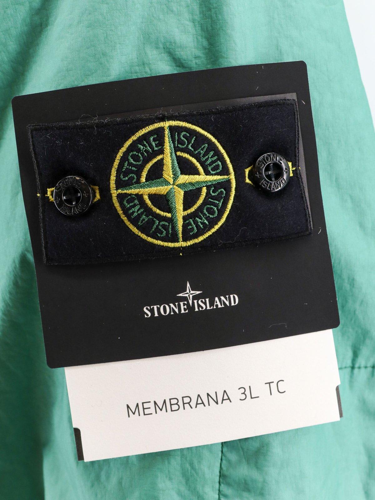 Shop Stone Island Logo Patch Drawstring-hooded Raincoat In Light Green