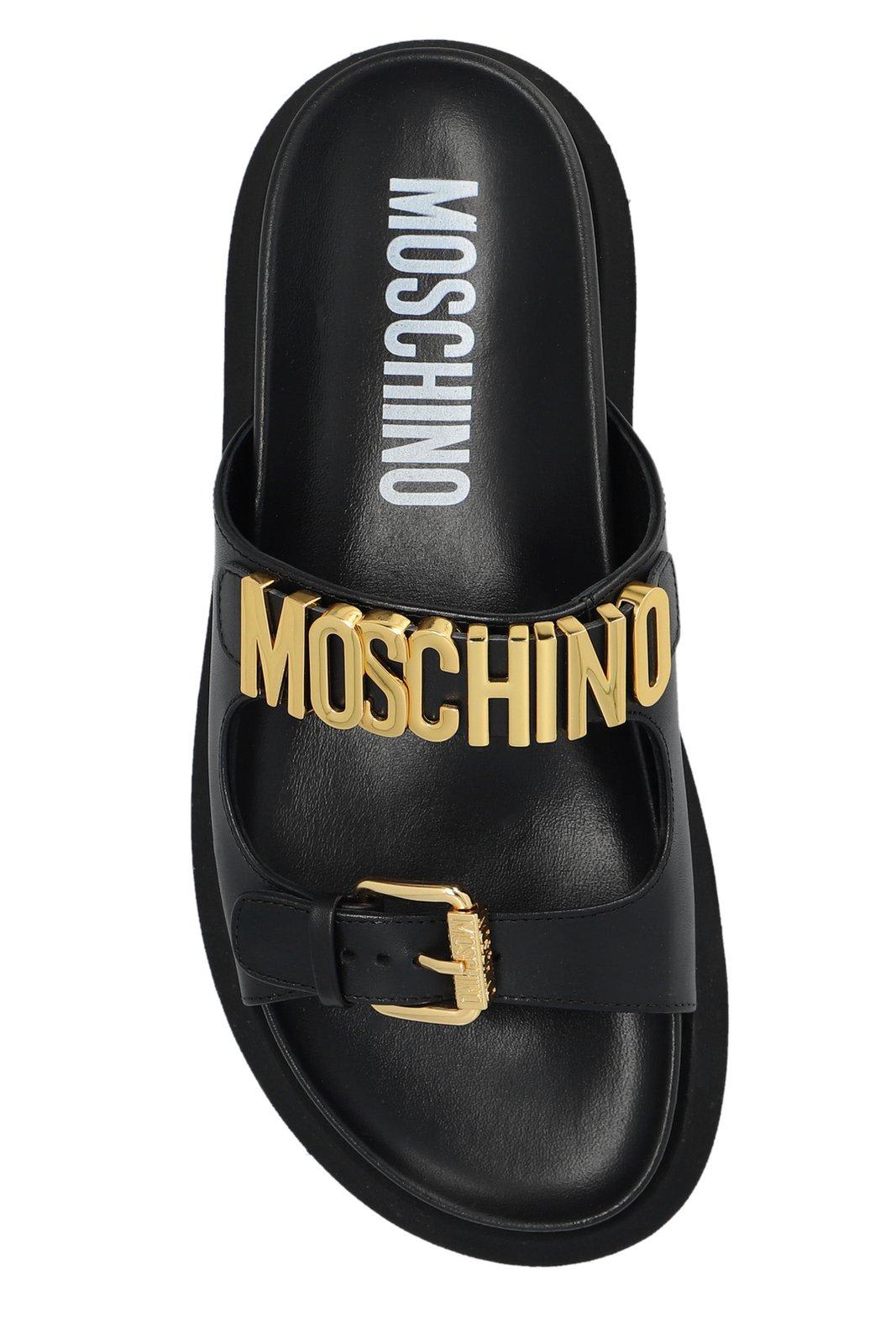 Shop Moschino Logo Lettering Slip-on Sandals In Black