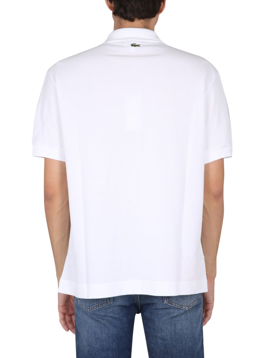 Shop Lacoste Loose Fit Polo. In White