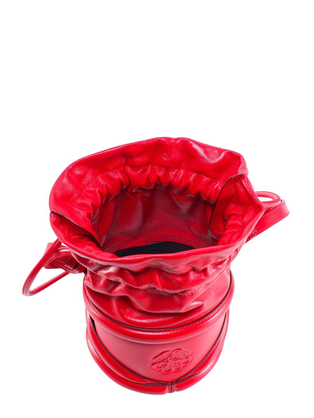 Shop Alexander Mcqueen Logo Detailed Drawstring Bucket Bag In Red